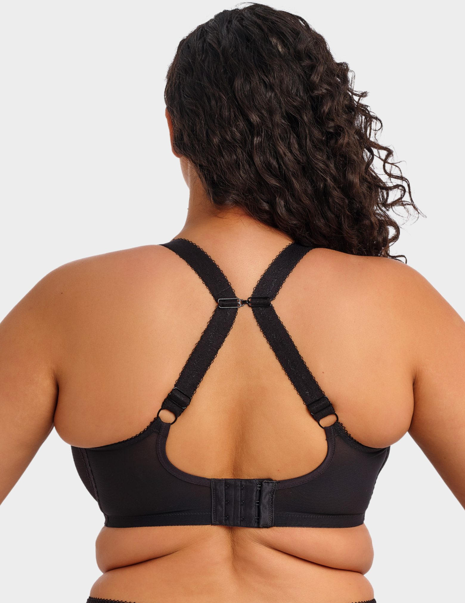 Back view of a model wearing Elomi Charley stretch plunge bra in black with straps hooked