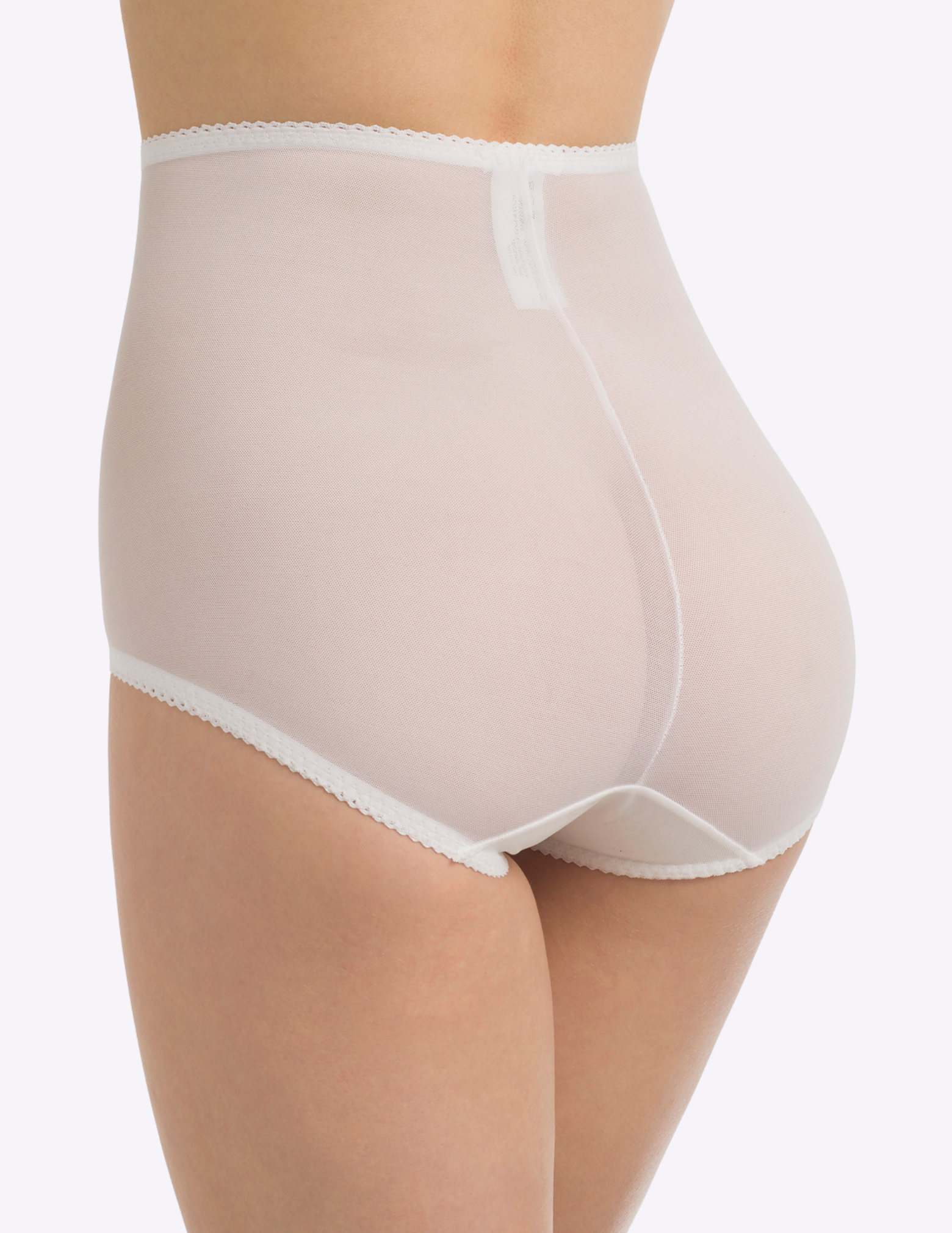 Back view of a model wearing Rago 40 sheer white shaping panty