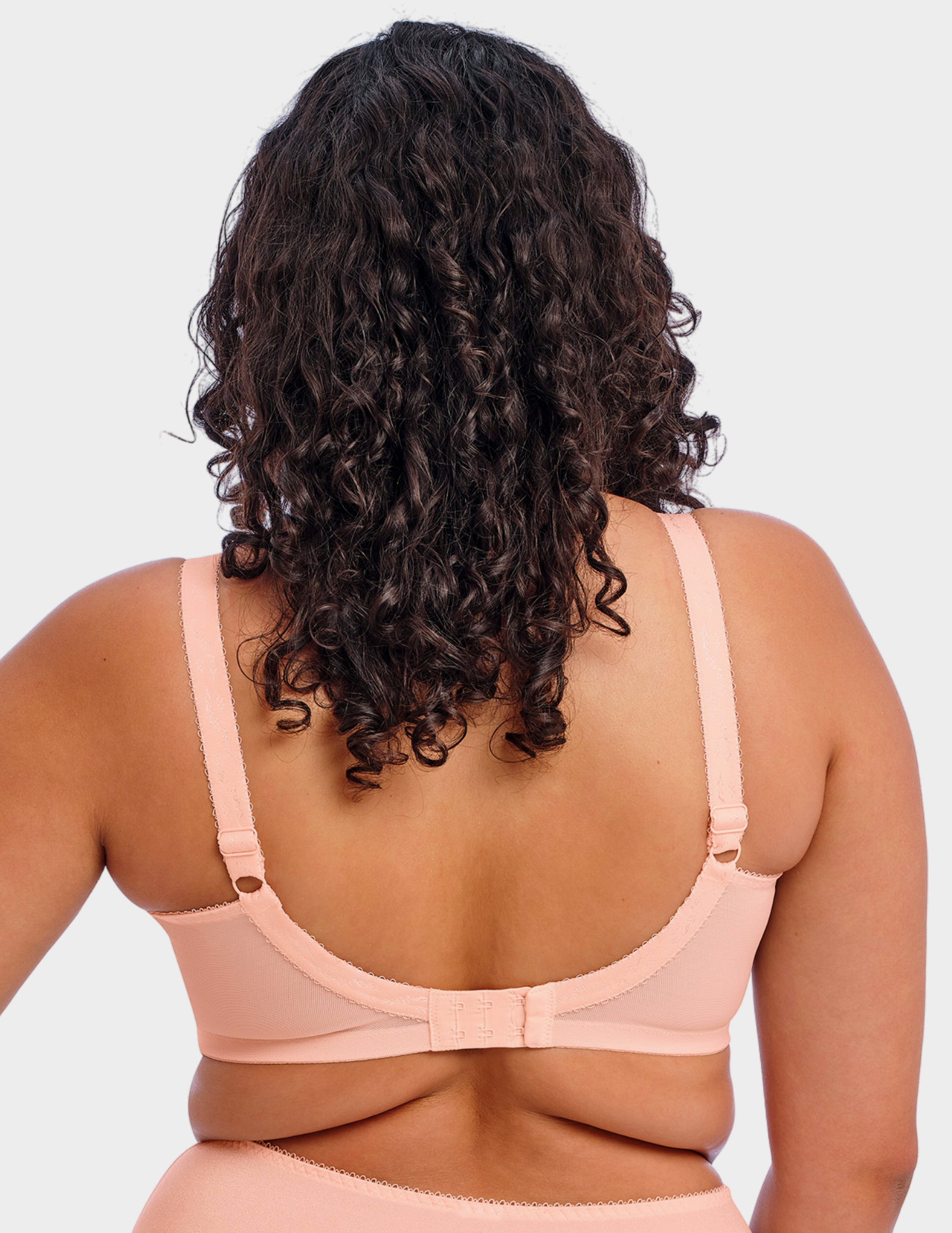 Back view of a model wearing Goddess Keira bra in Pearl Blush