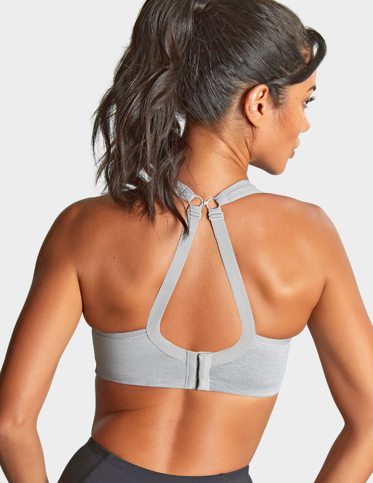 Back view of a model wearing Panache Power sports bra in Grey Marl with straps hooked