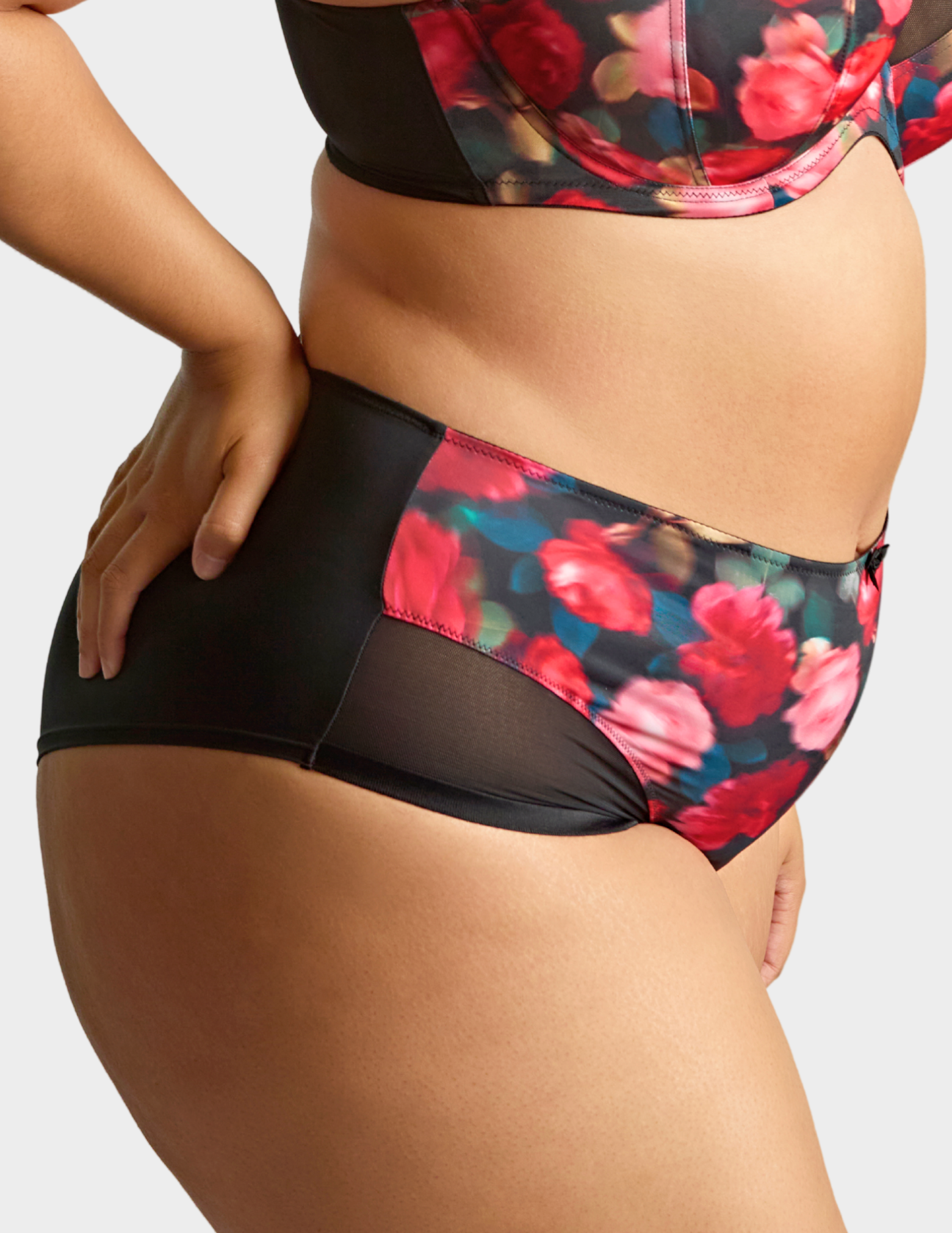 Side view of a model wearing Sculptresse Bliss brief in Rose Print
