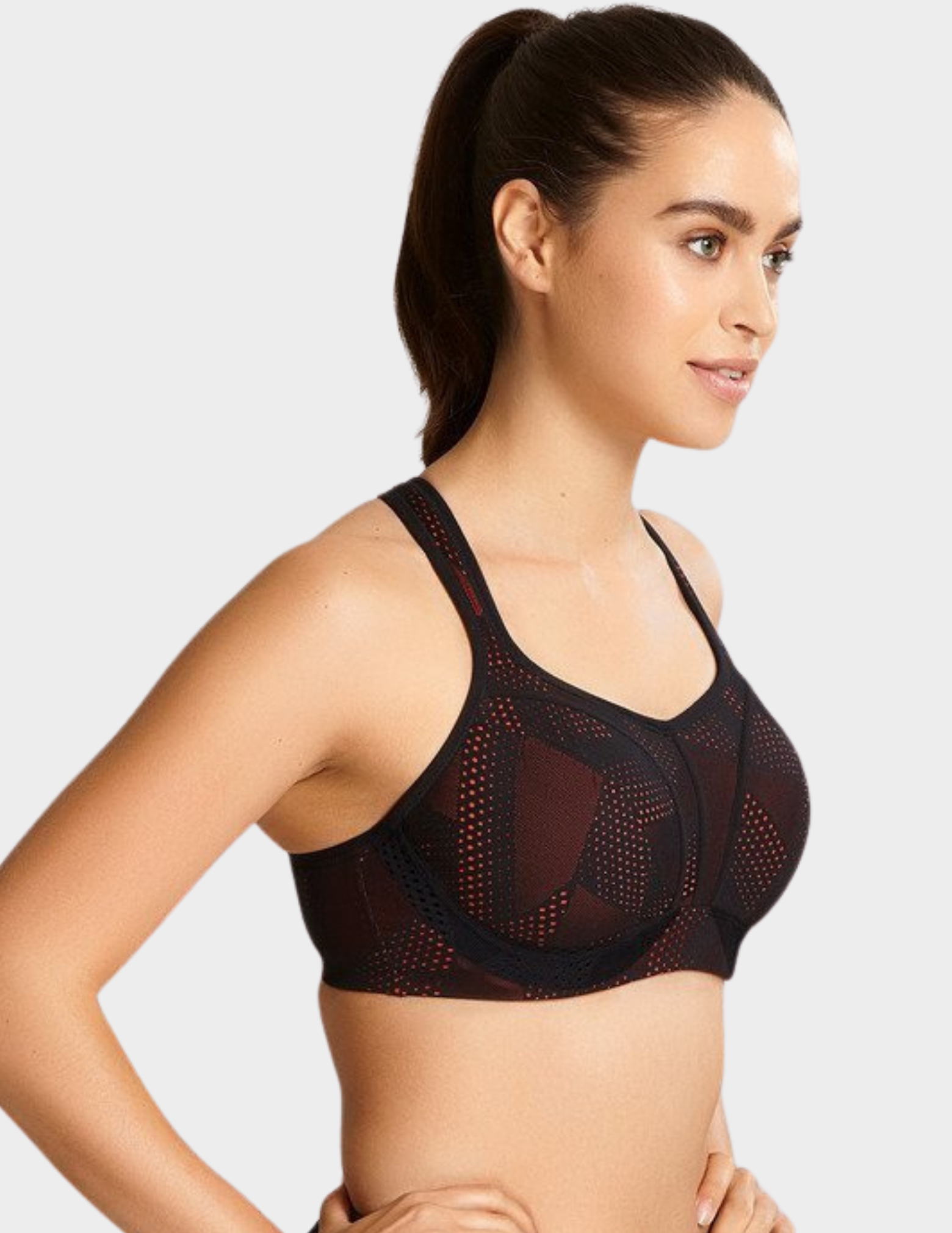Side view of a model wearing Panache Power sports bra in Black Coral