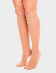 Front view of a model wearing Glamory Fit50 Knee Highs in Makeup