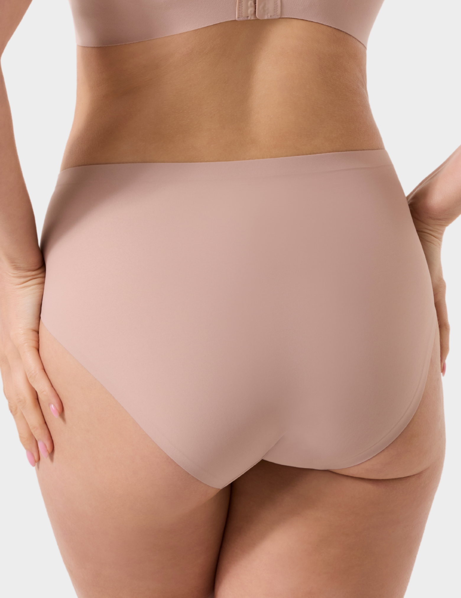 Back view of a model wearing Evelyn & Bobbie high waist brief in Petal Drift