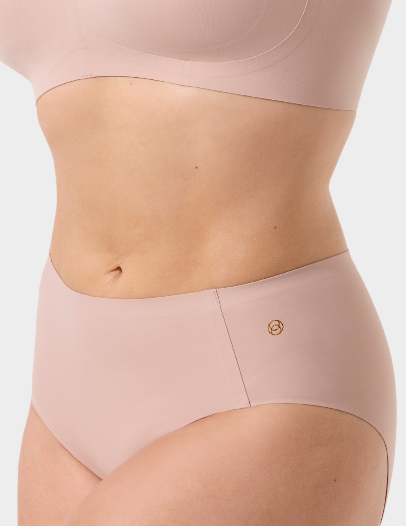 Side view of a model wearing Evelyn & Bobbie high waist brief in Petal Drift