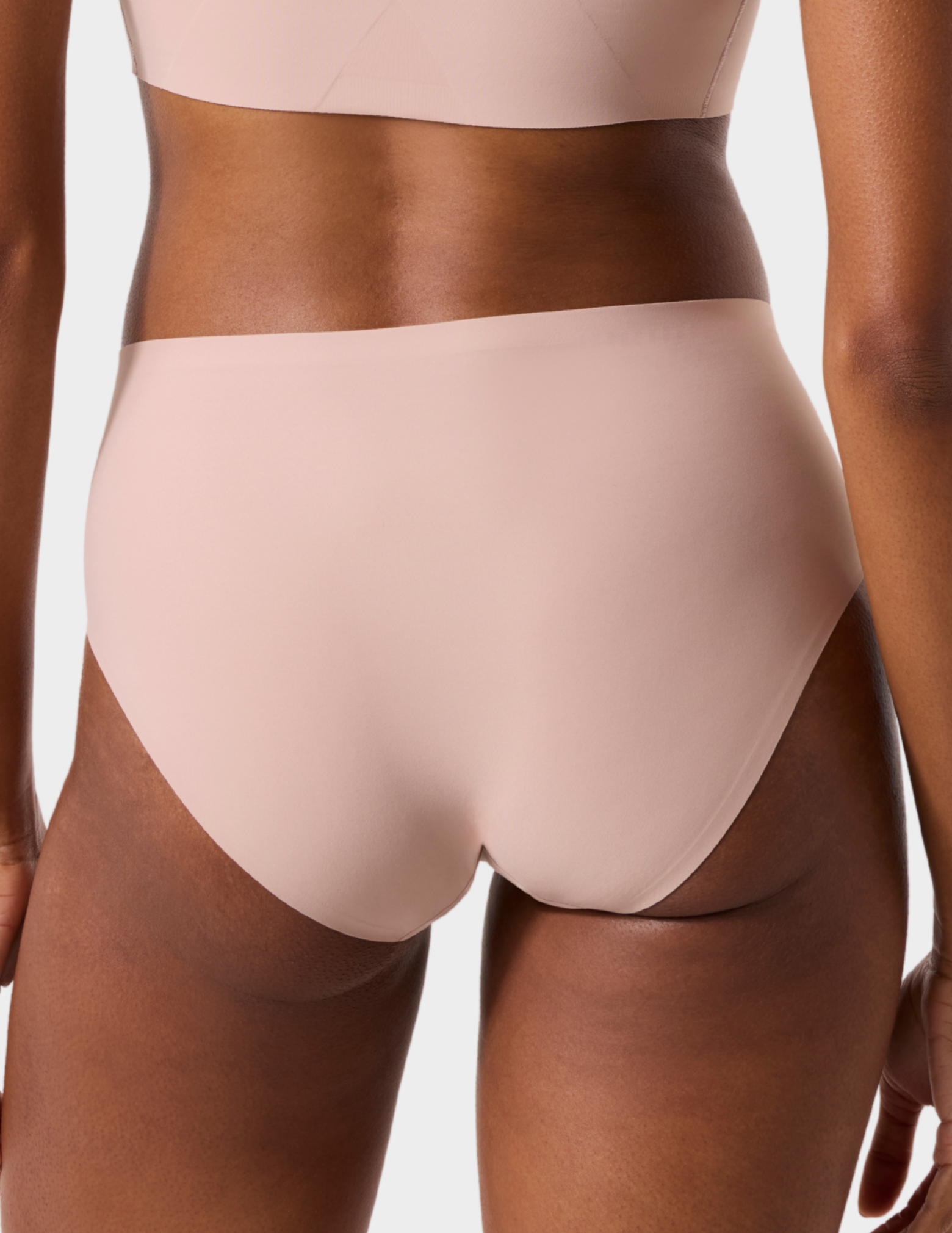 Back view of a model wearing Evelyn & Bobbie high waist brief in Petal Drift