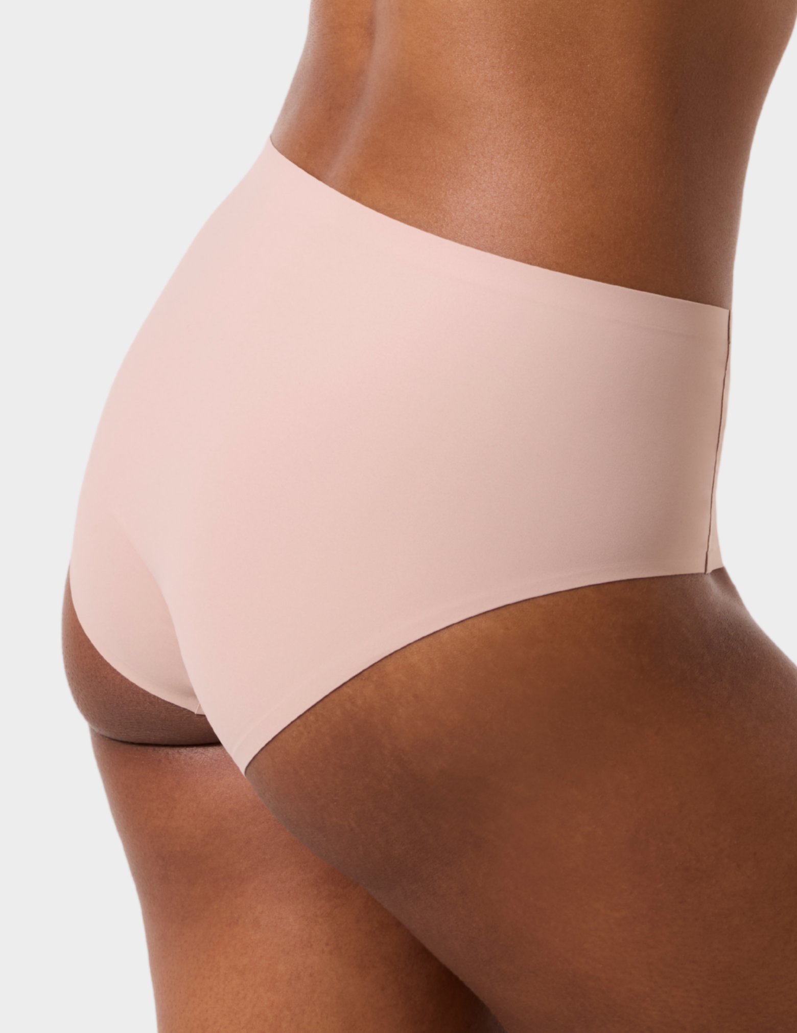 Side view of a model wearing Evelyn & Bobbie high waist brief in Petal Drift