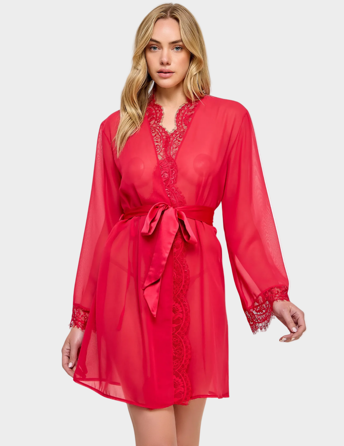 Front view of a model wearing a semi-sheer red robe with lace trim
