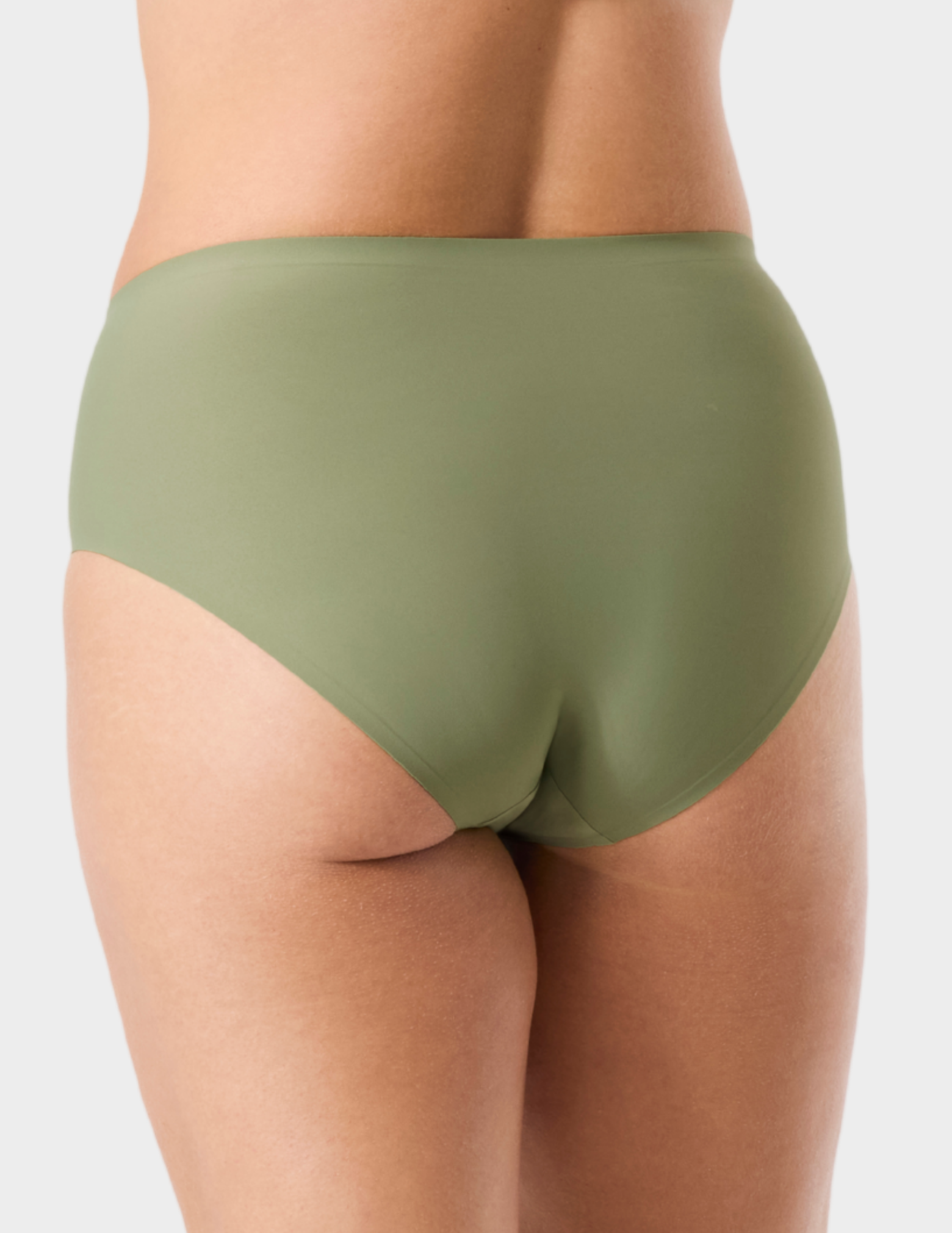 Back view of a model wearing Evelyn & Bobbie high waist brief in Matcha