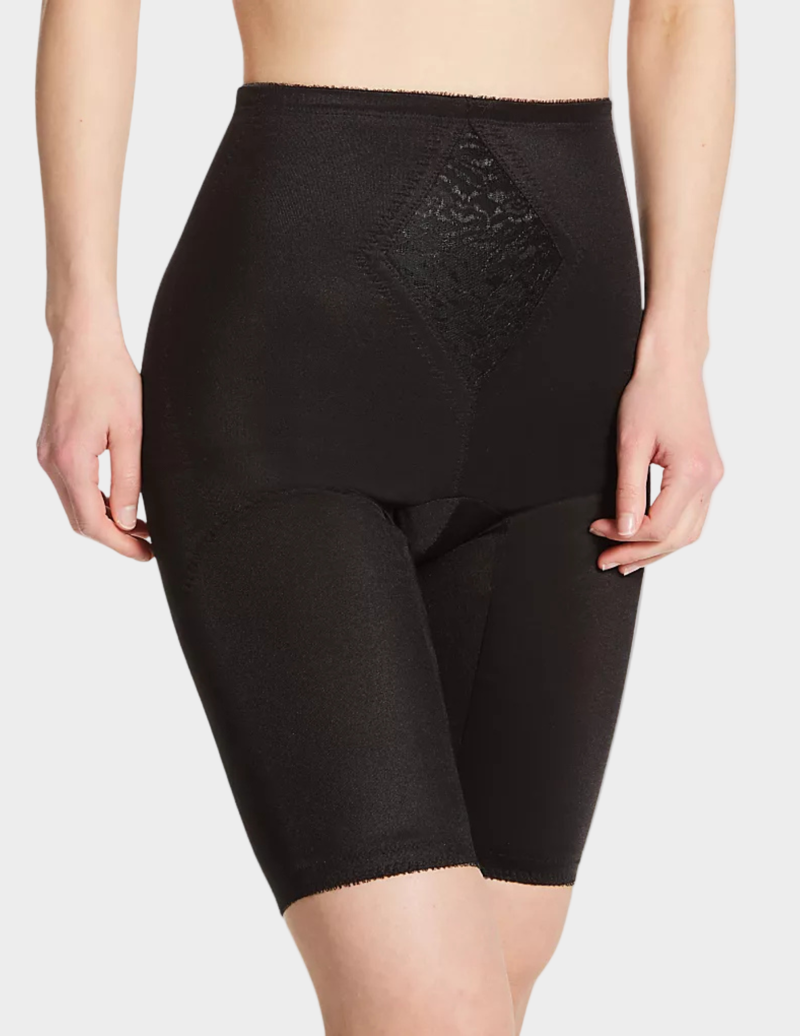 Side view of a model wearing Rago 6205 black shaping shorts