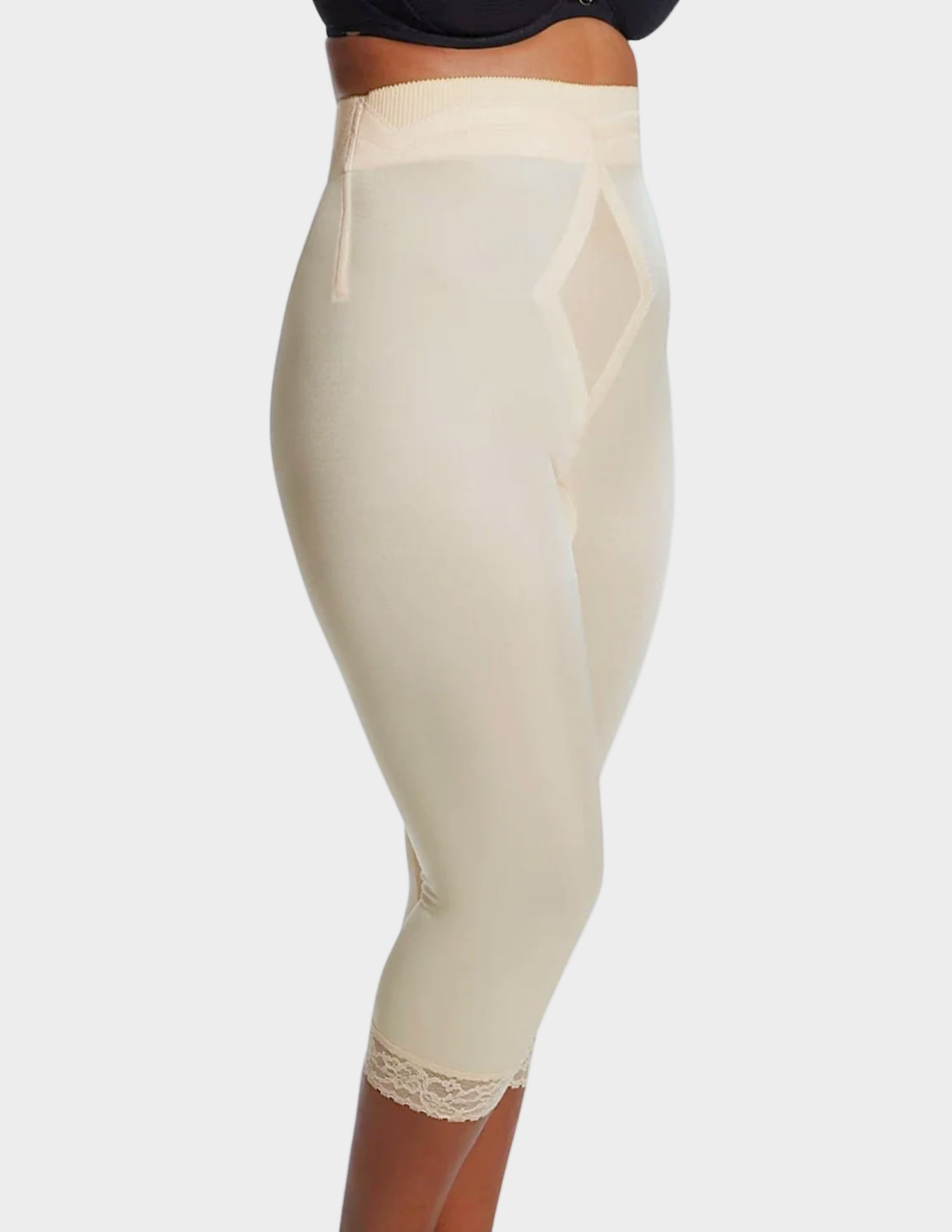 side view of a model wearing beige Rago 6266 leg shaper