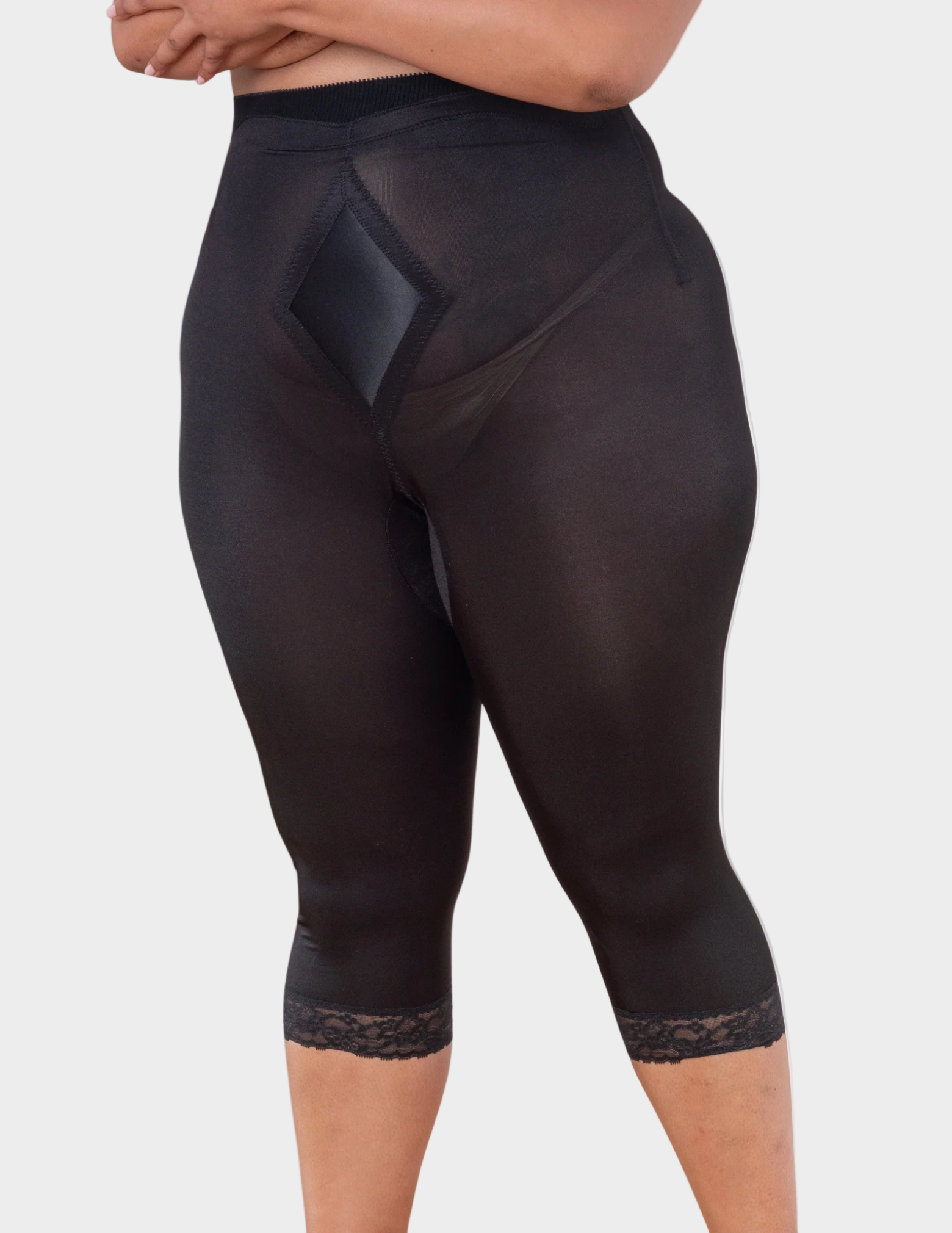 front view of a plus size model wearing black Rago 6266 leg shaper