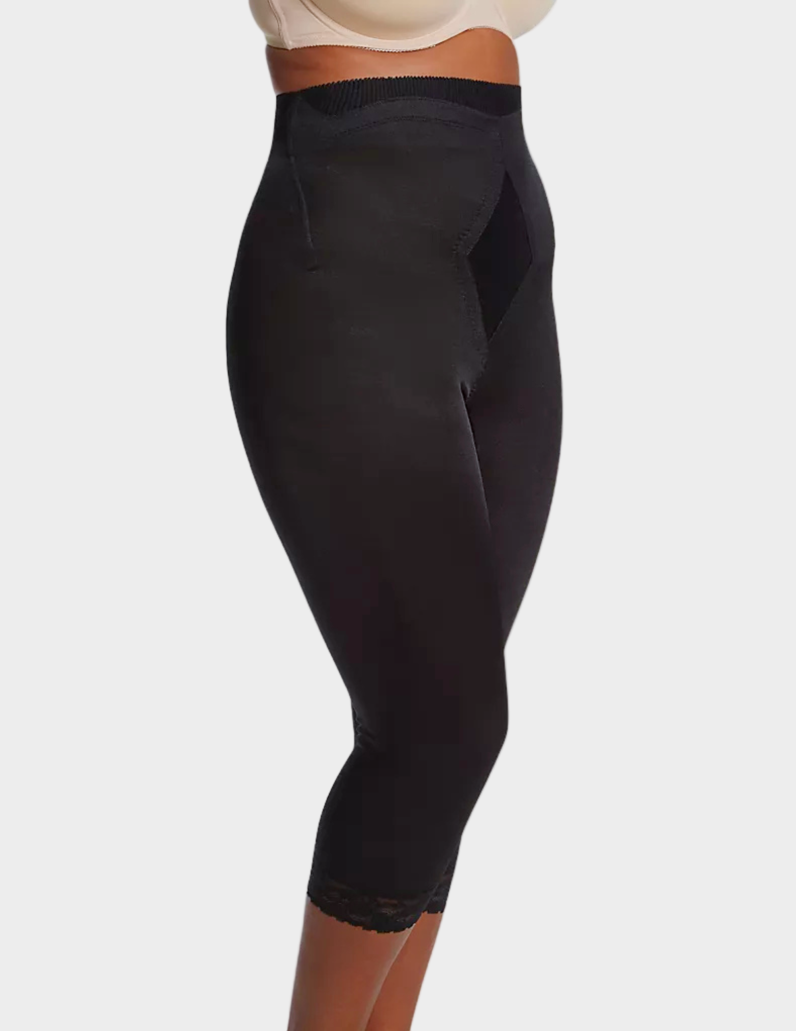 side view of a model wearing black Rago 6266 leg shaper