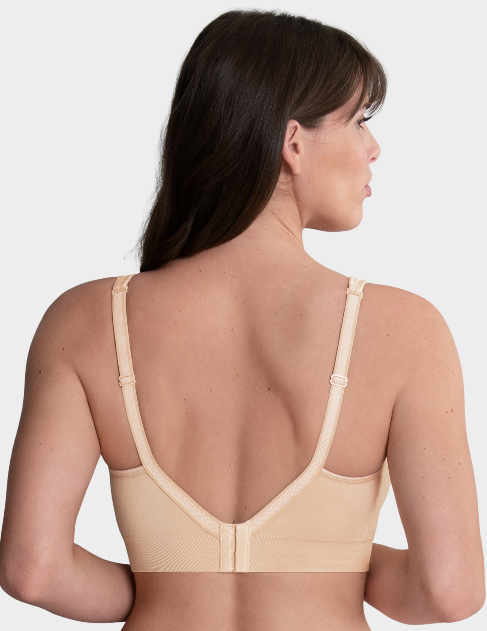 Back view of a model wearing Anita Lotta post mastectomy bra in color Desert