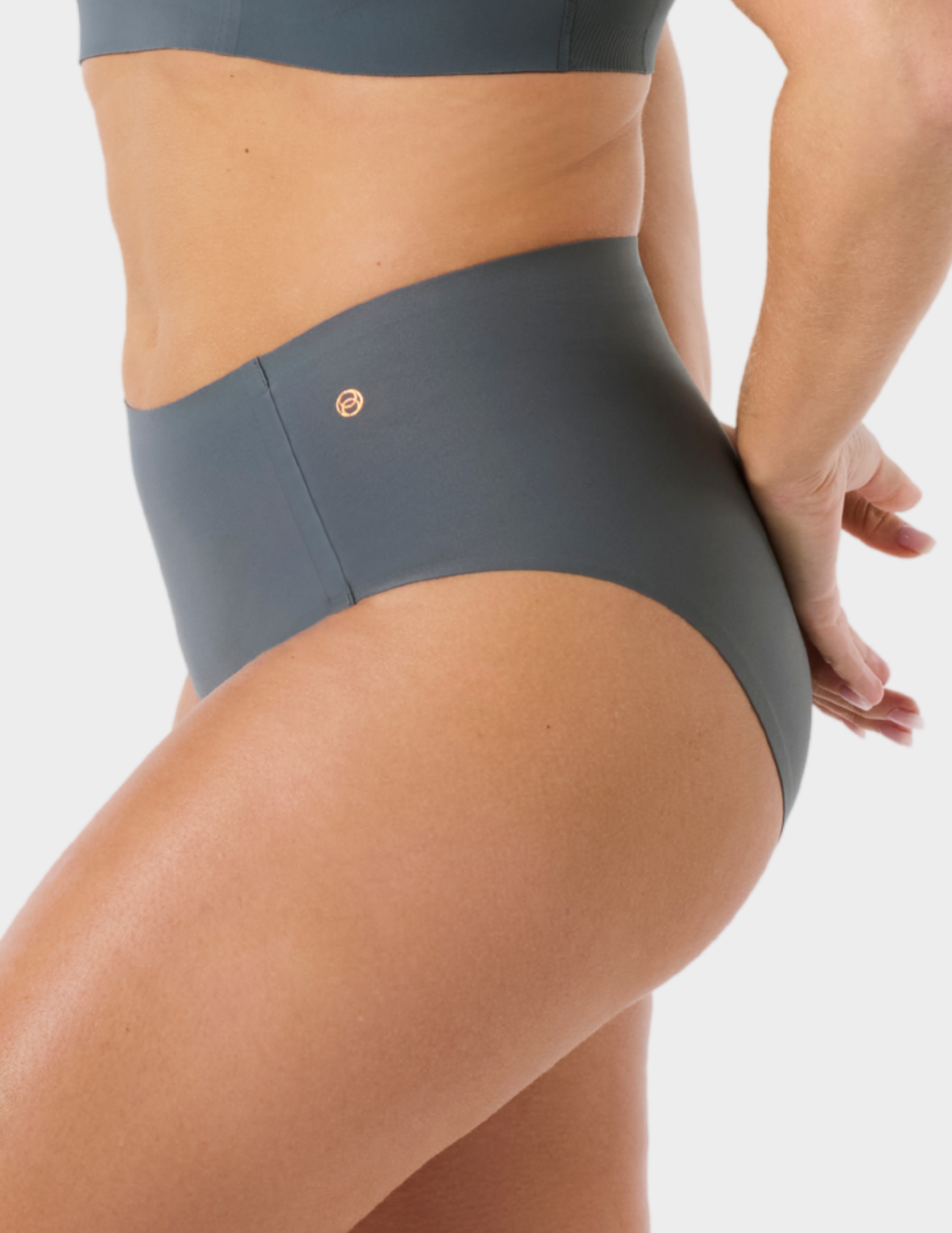 Side view of a model wearing Evelyn & Bobbie high waist brief in Slate Grey