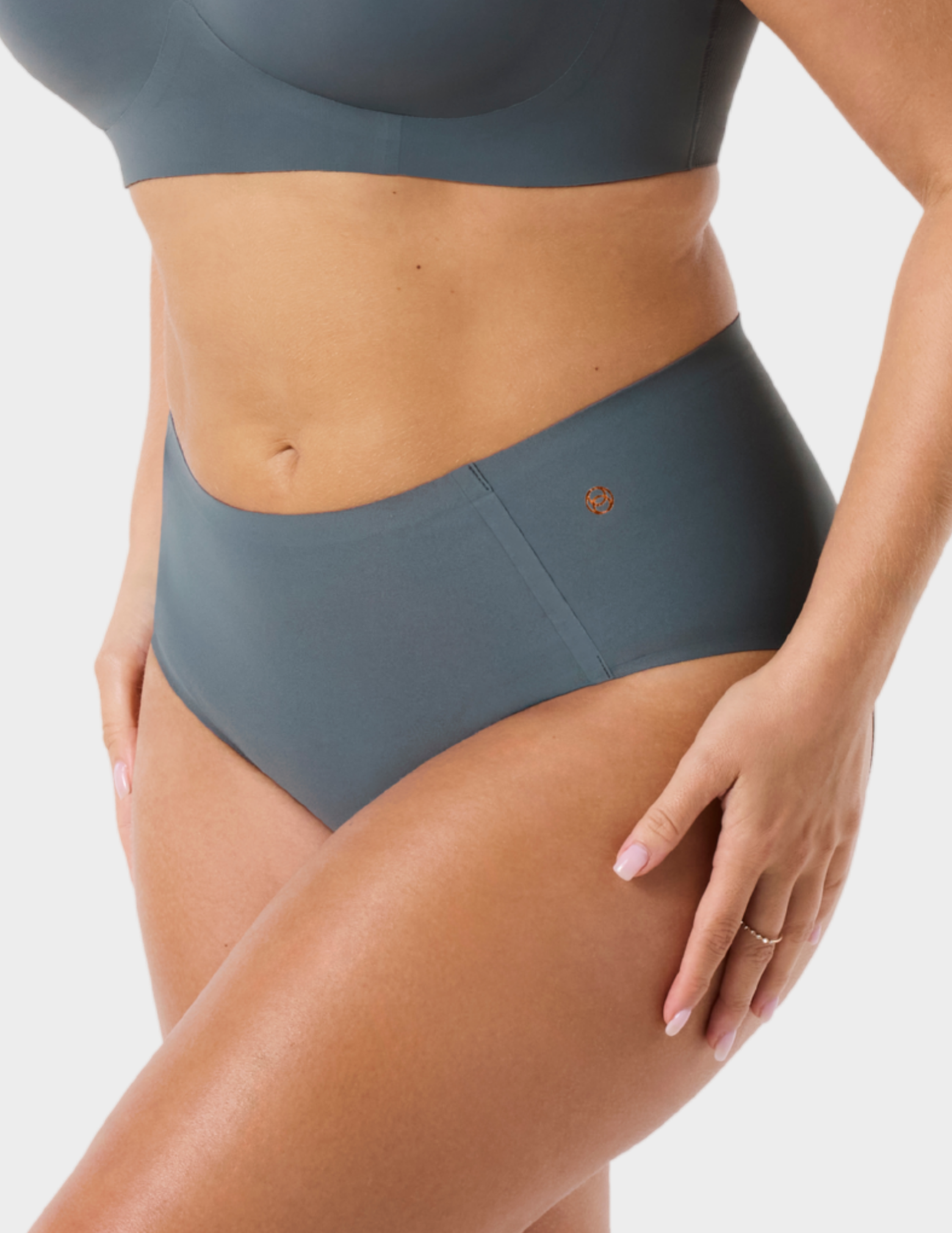 Side view of a model wearing Evelyn & Bobbie high waist brief in Slate Grey