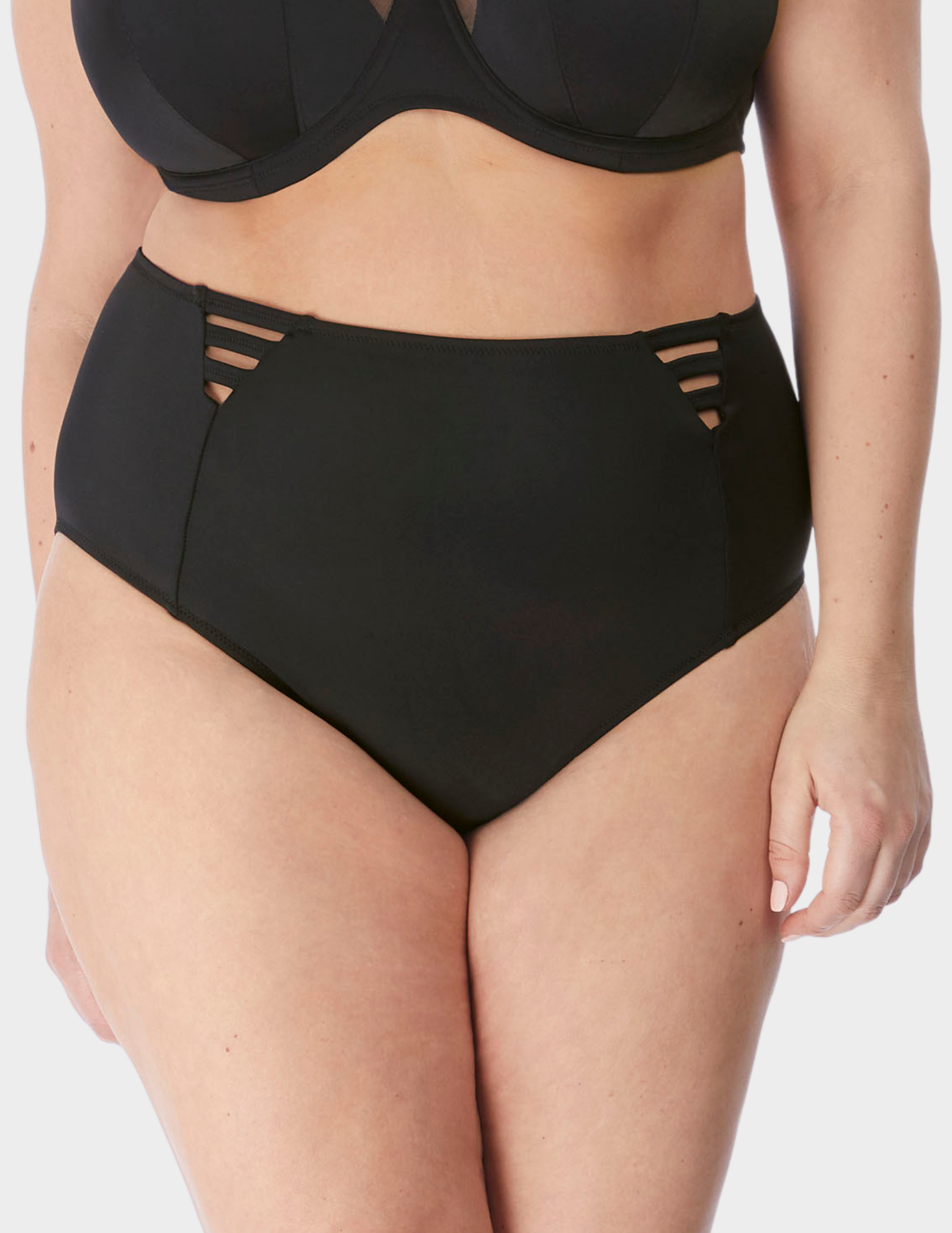 Front view of a model wearing Elomi magnetic swim brief in black