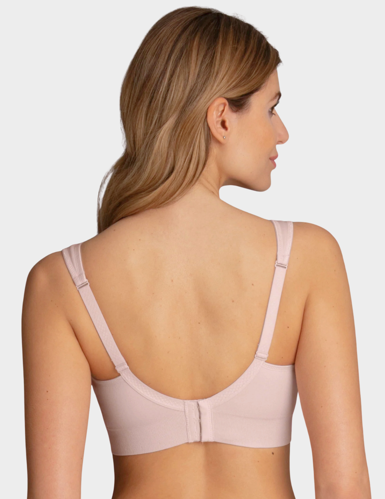 Back view of a model wearing Anita Lotta post mastectomy bra in color Lotus