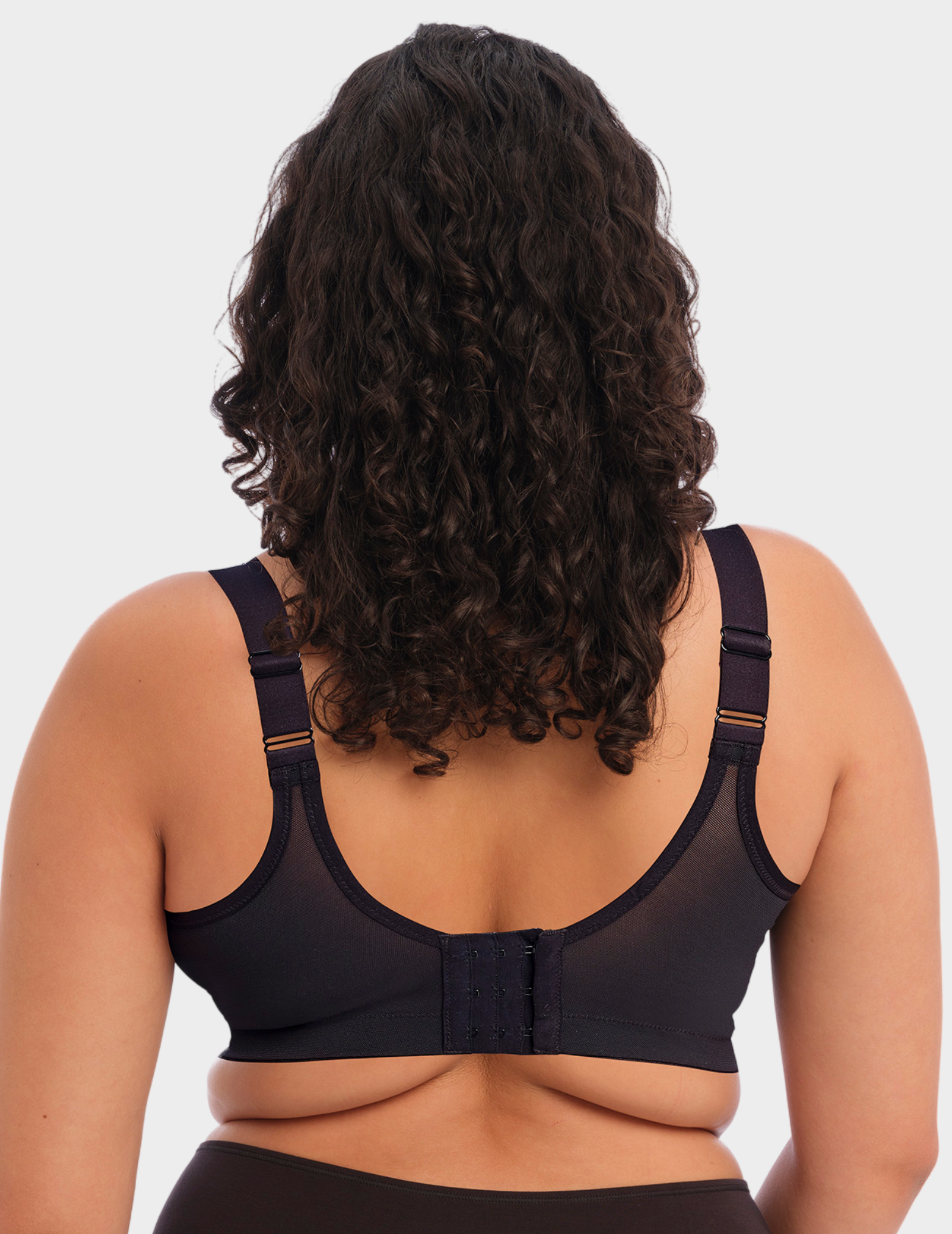 Back view of a model wearing Goddess Celeste bralette in grey leopard