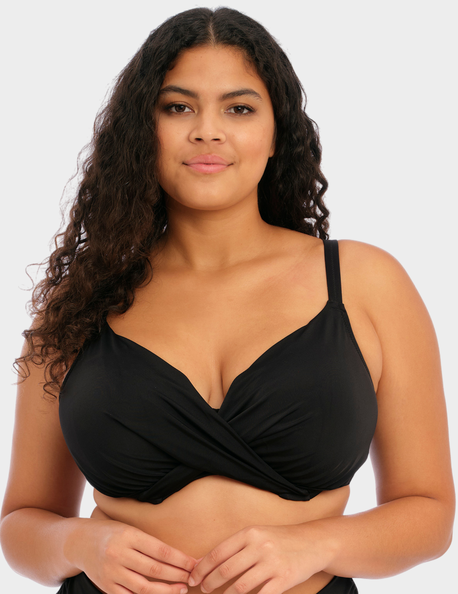 Front view of a model wearing Elomi magnetic bikini top in black
