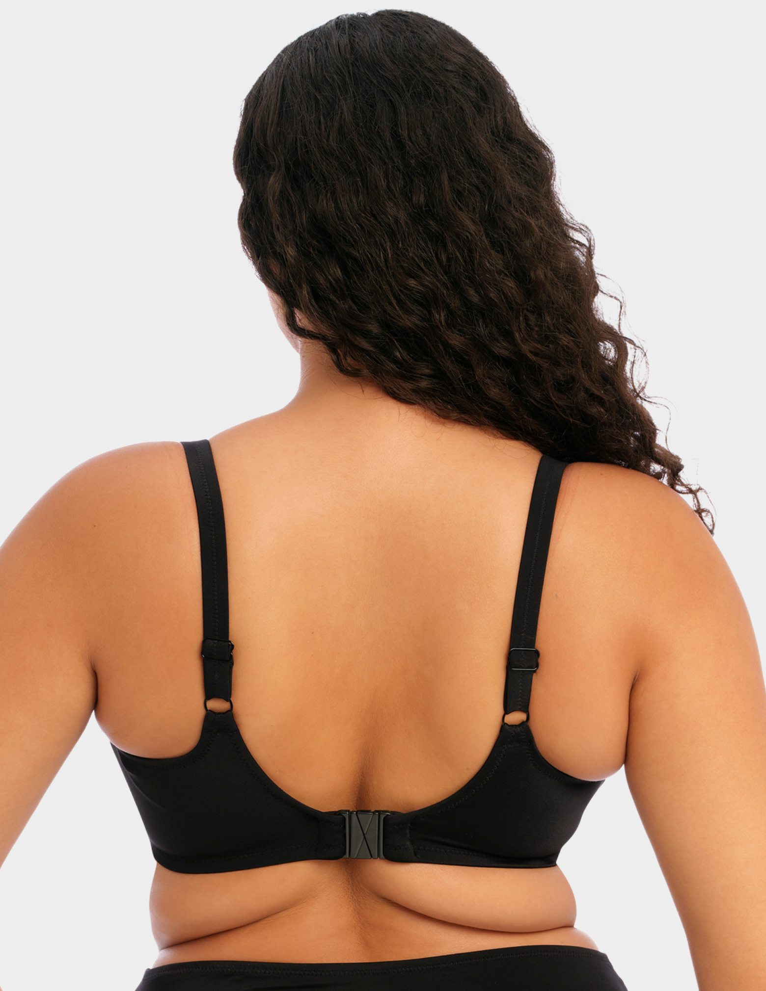 Back view of a model wearing Elomi magnetic bikini top in black