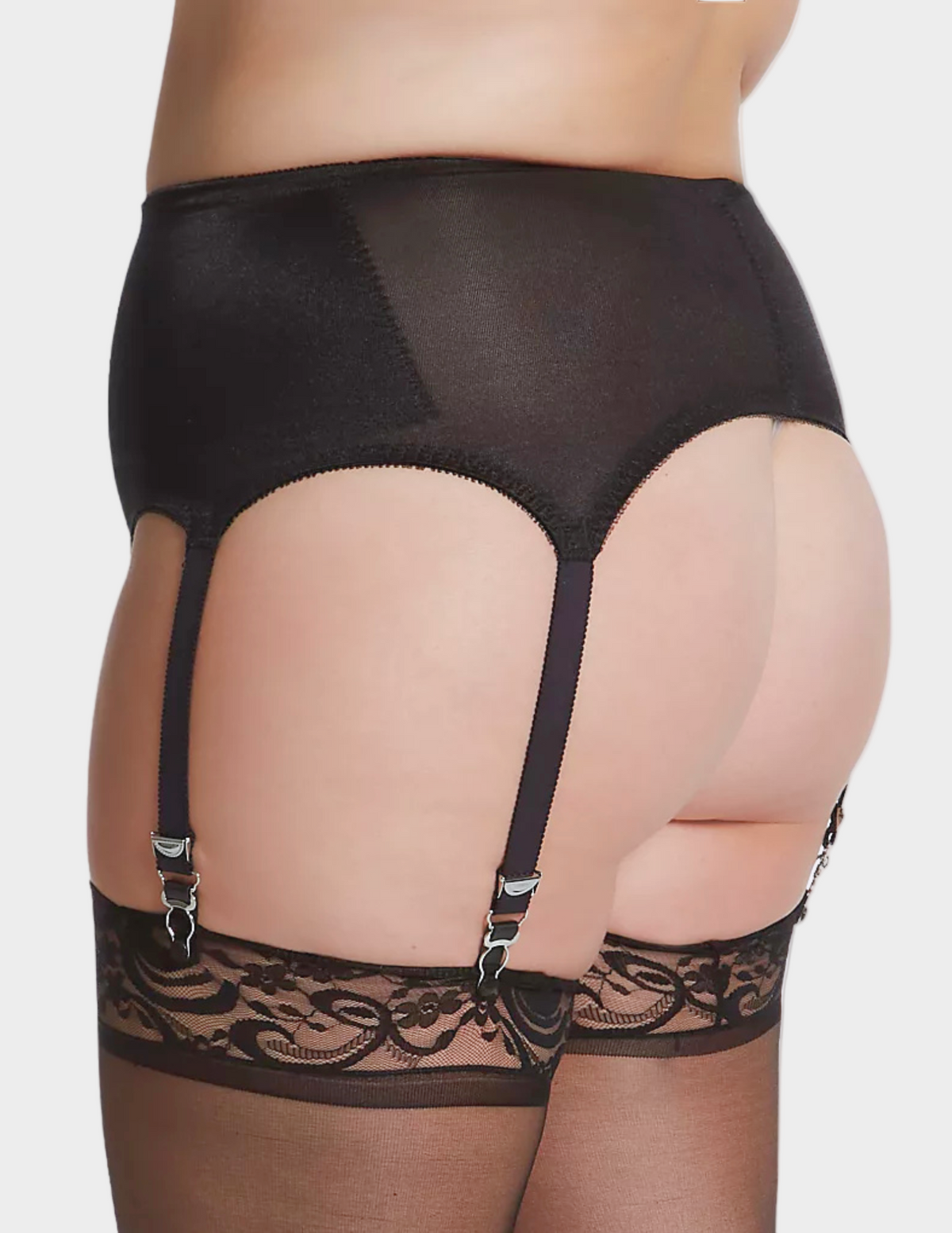 Side view of plus-size model wearing black Rago garter belt