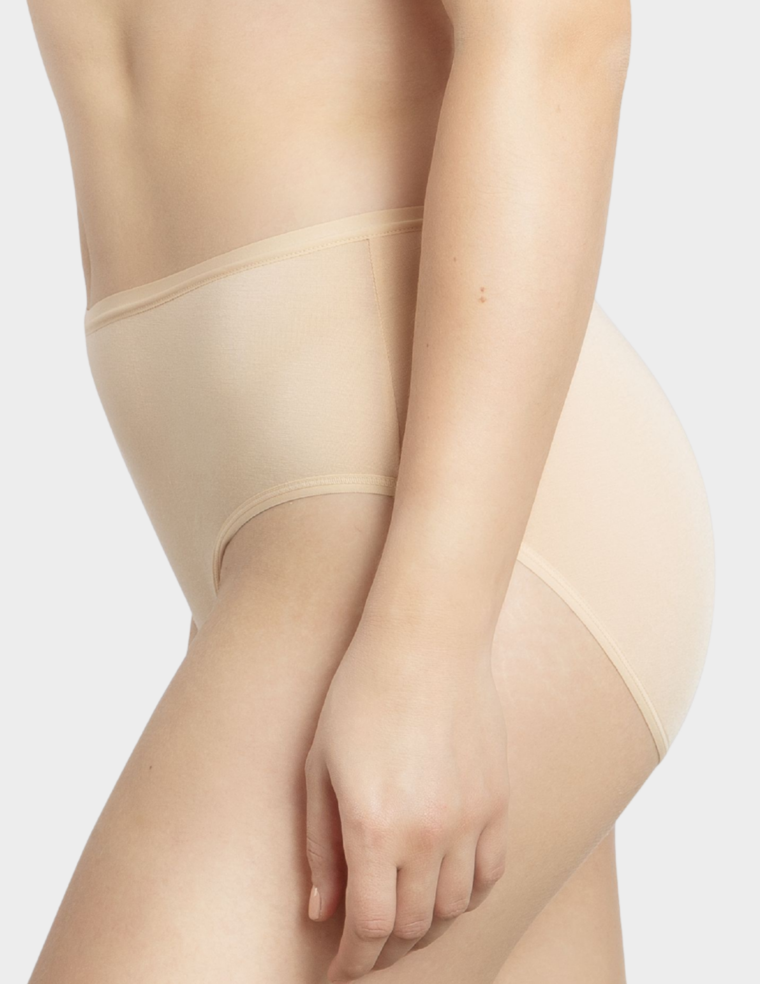 Side view of a model wearing Parfait Cozy hipster panty in Bare