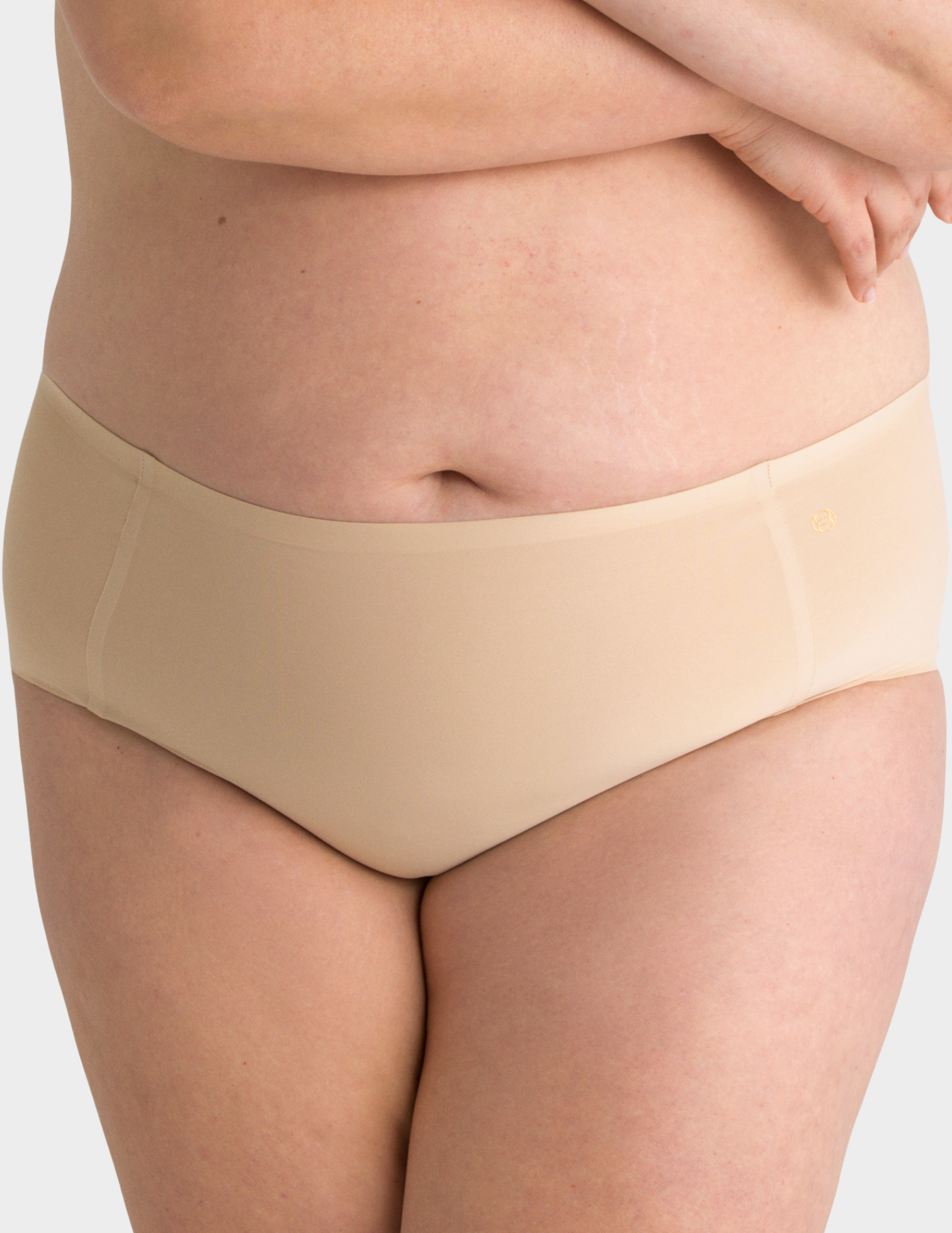 Front view of a model wearing Evelyn & Bobbie high waist brief in Sand