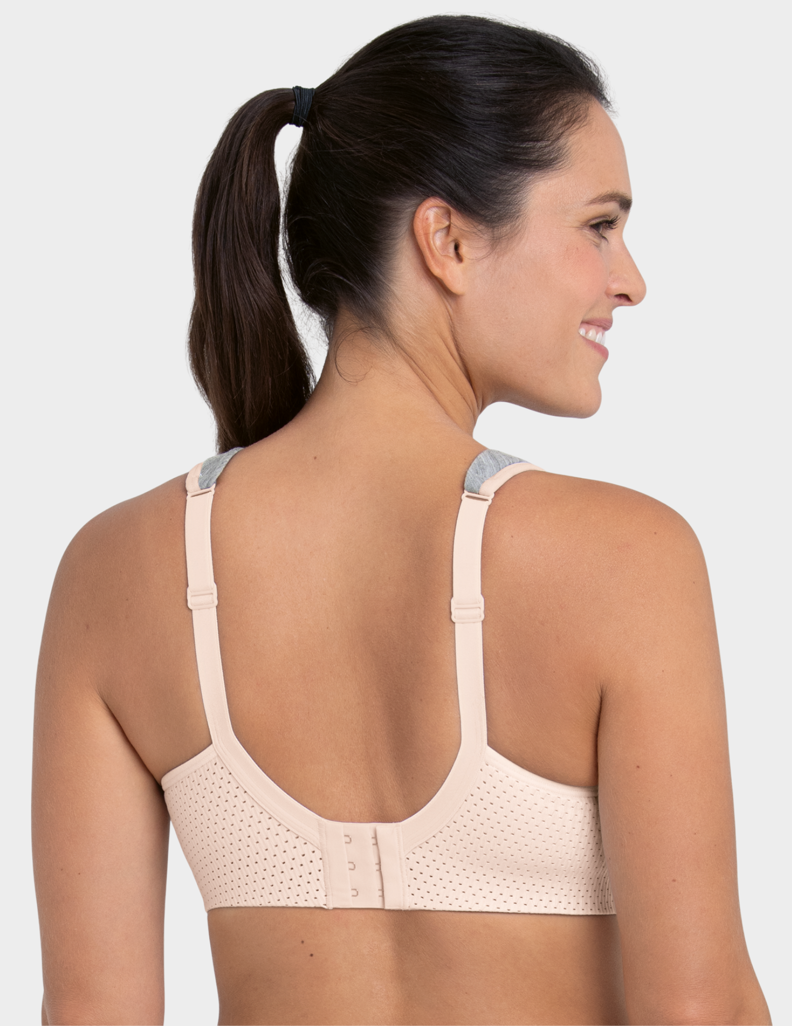 Back view of a model wearing an Anita PanAlp Wool sports bra in color Smart Rose