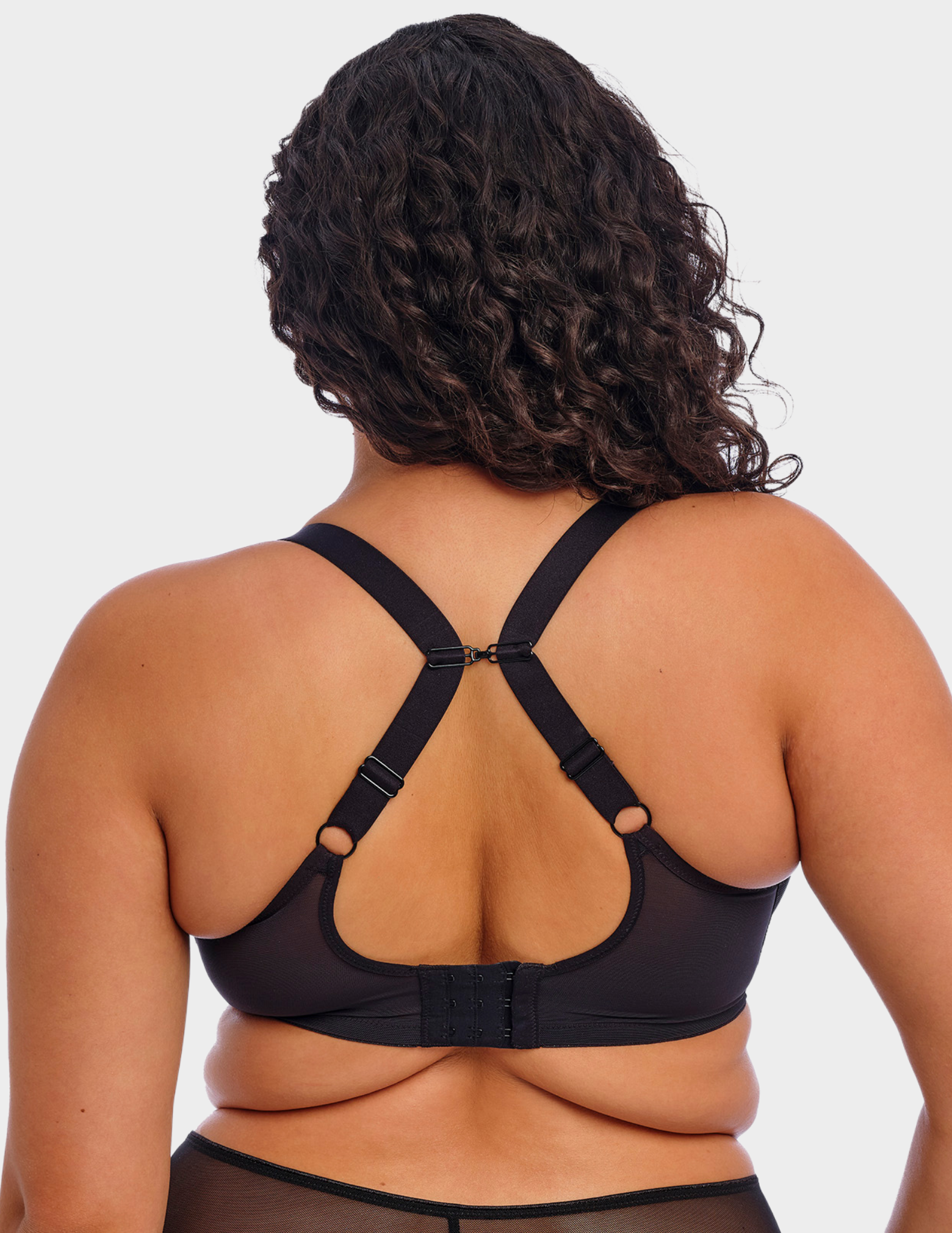 Back view of a model wearing Elomi Matilda plunge bra in black with straps hooked