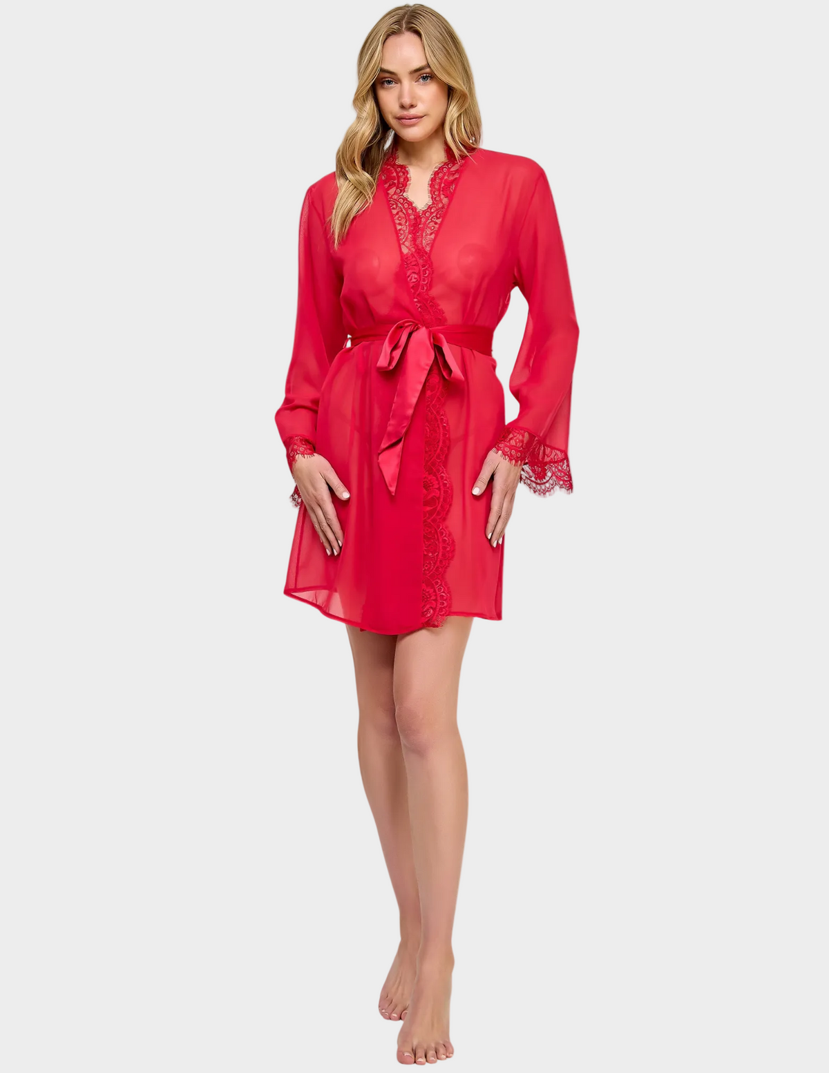 Full body front view of a model wearing a semi-sheer red robe with lace trim