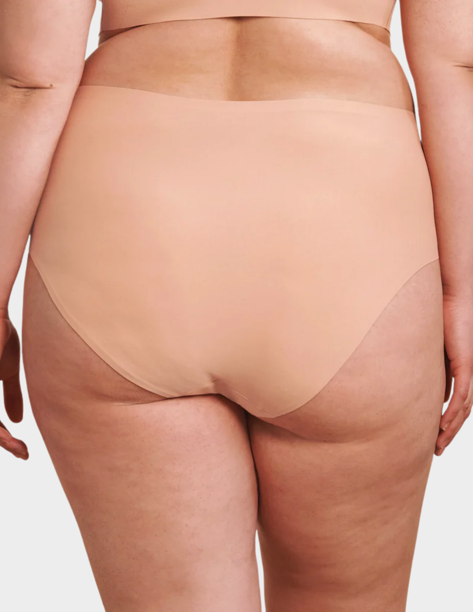 Back view of a model wearing Evelyn & Bobbie high waist brief in Himalayan Salt