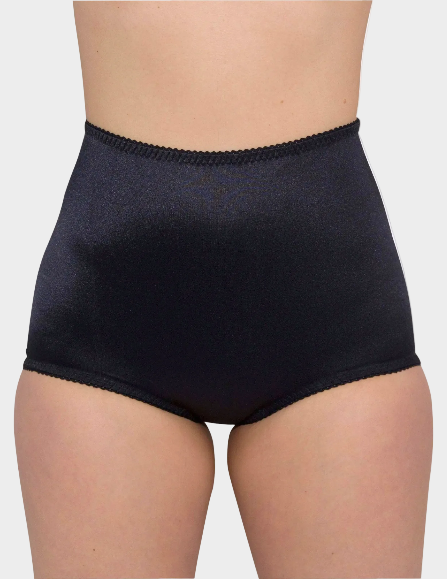 Front view of model wearing Rago 910 smoothing panty in black