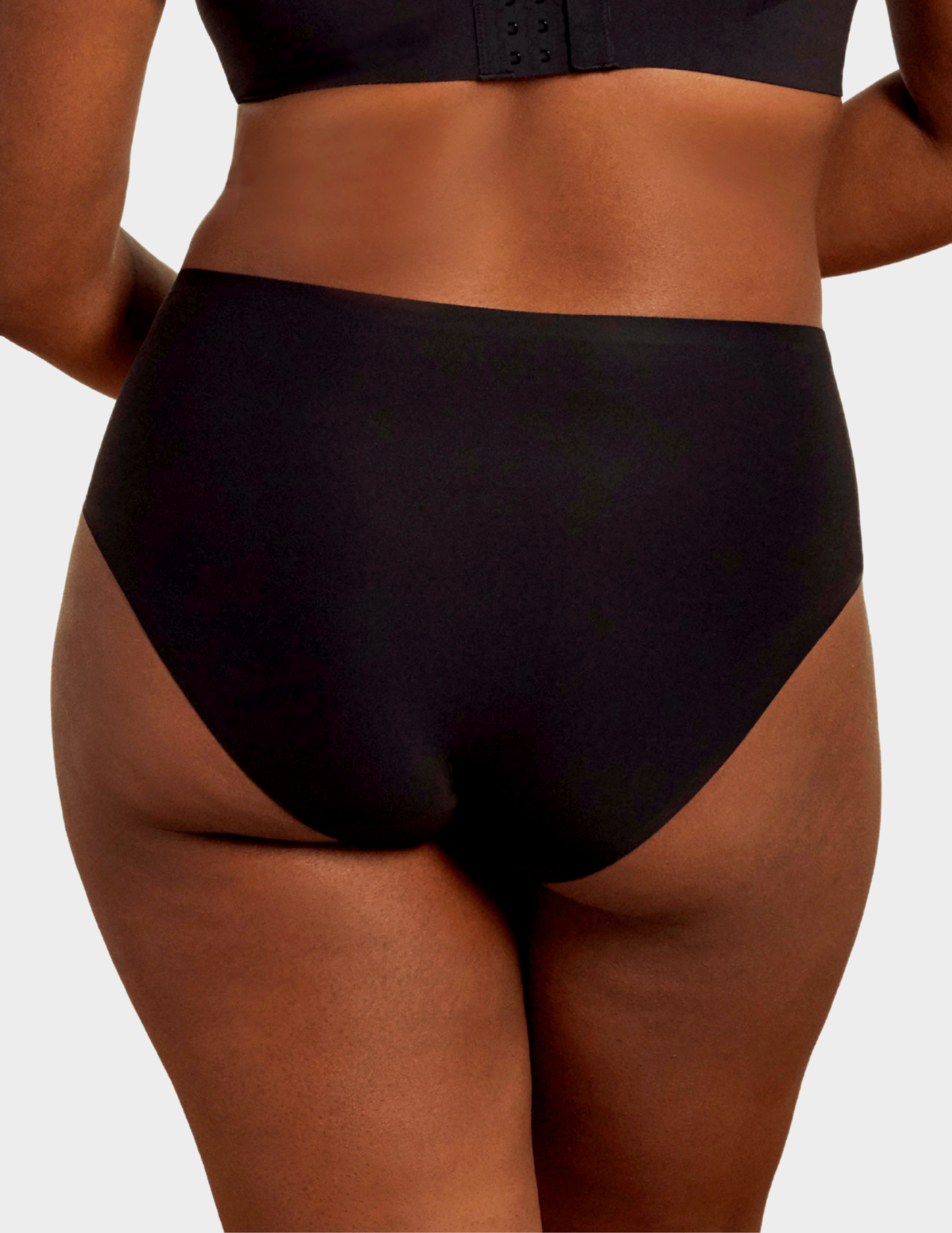 Back view of a model wearing Evelyn & Bobbie high waist brief in Black