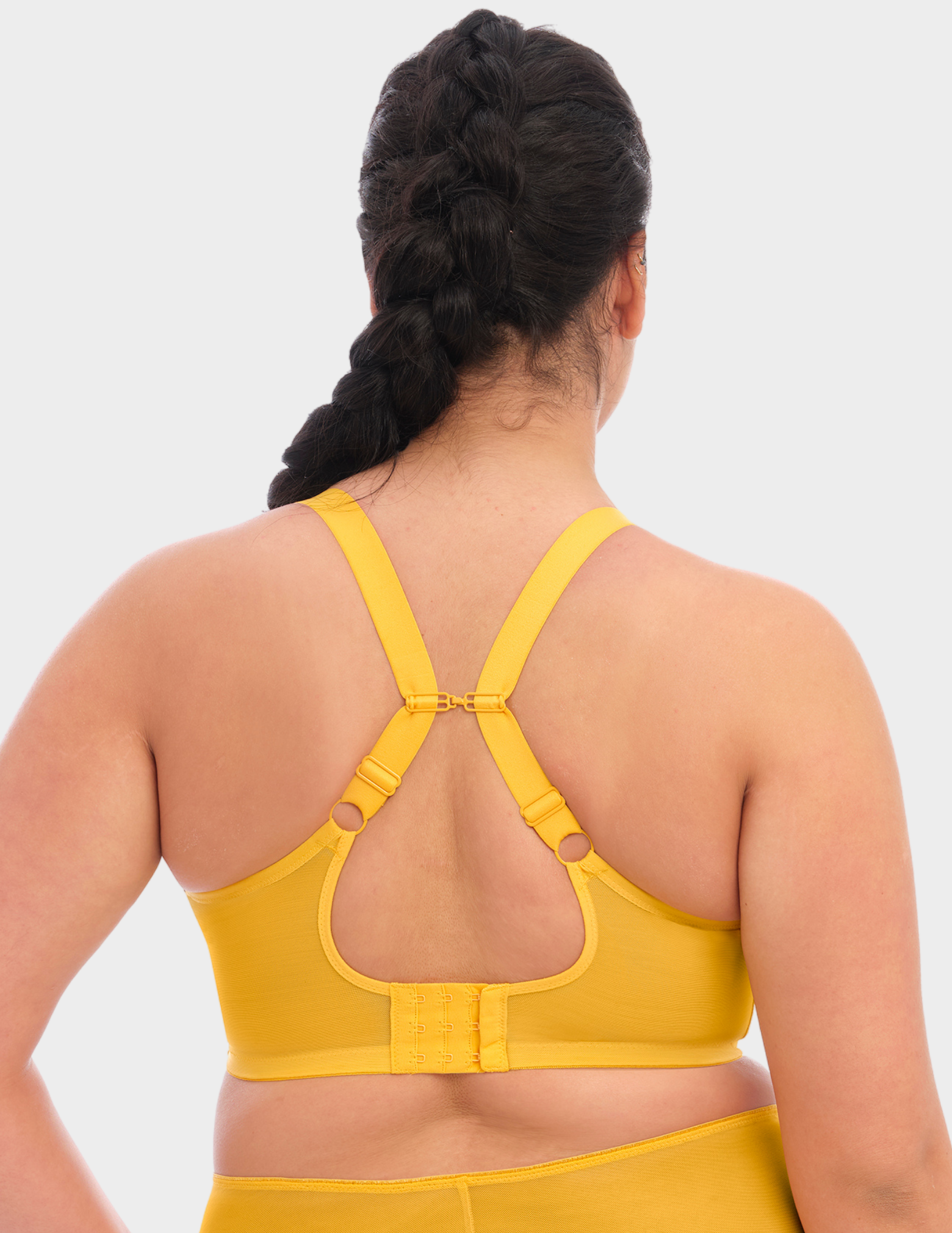 Back view of a model wearing Elomi Matilda plunge bra in daisy with straps hooked