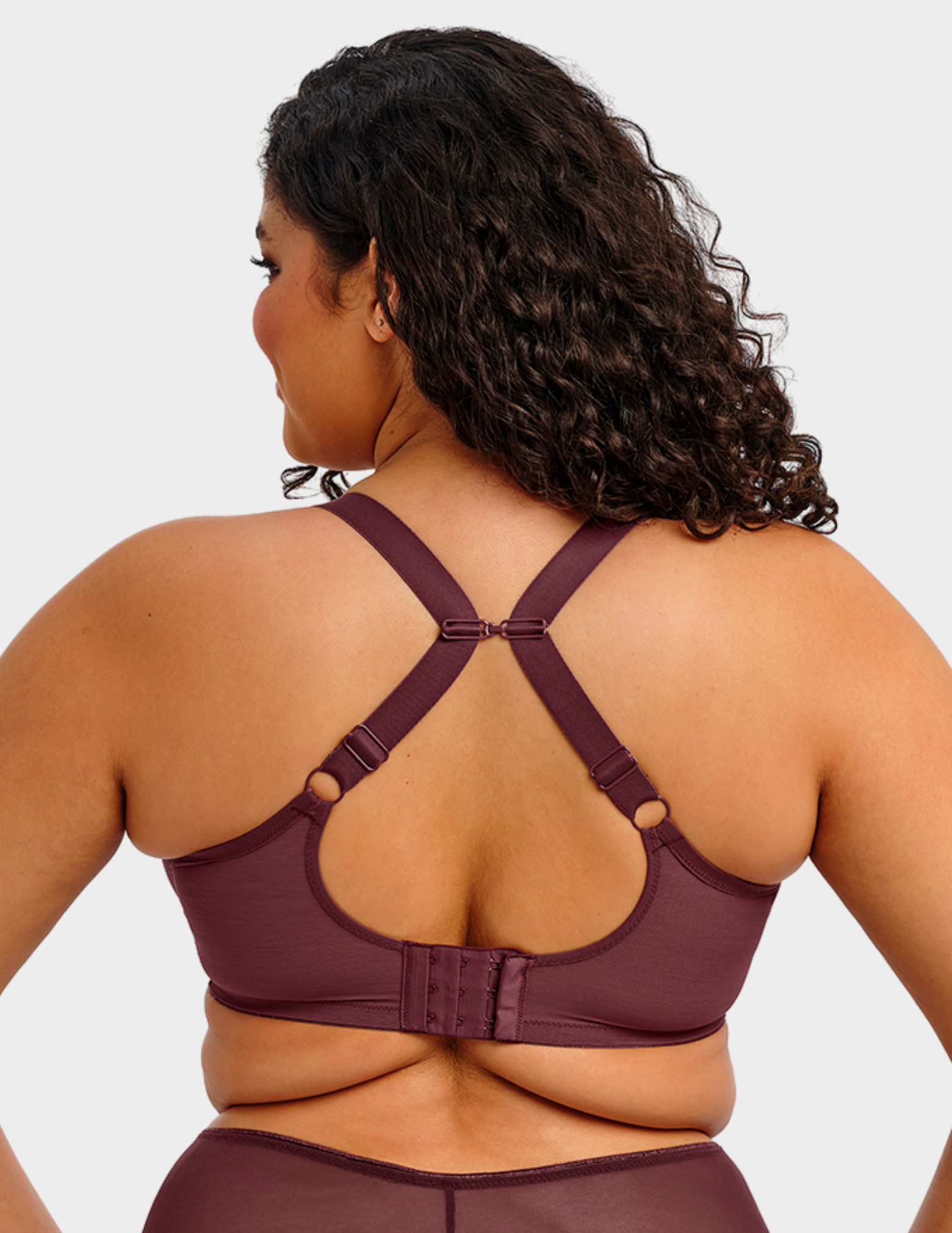 Back view of a model wearing Elomi Matilda plunge bra in sugarplum with straps hooked