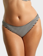 Front view of a model wearing Panache Classic swim brief in black gingham