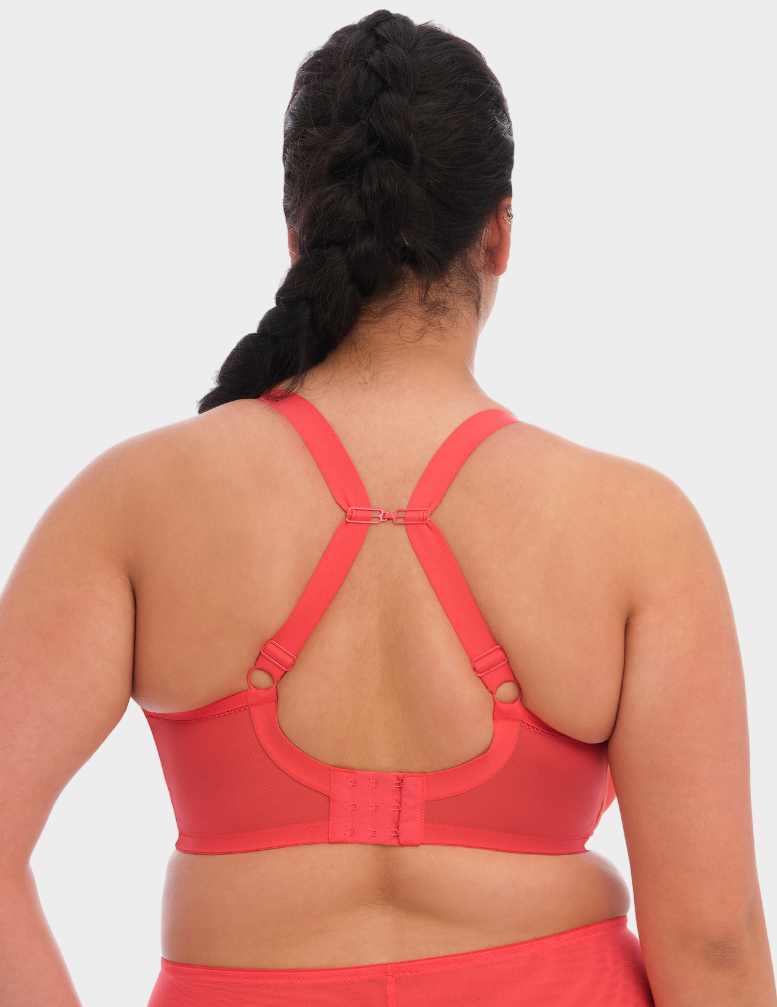 Back view of a model wearing Elomi Bijou plunge bra in cayenne with straps hooked