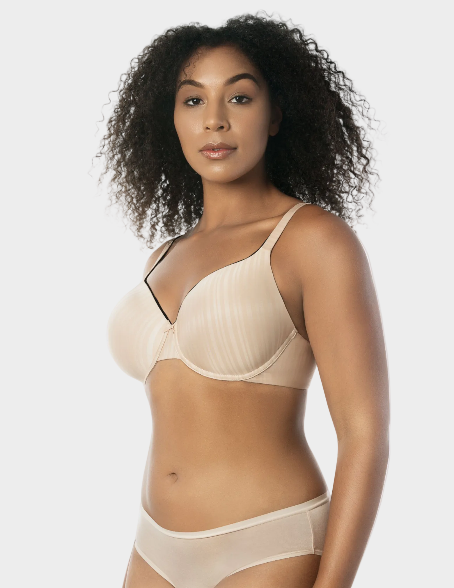 Side view of a model wearing beige and black Aline t-shirt bra