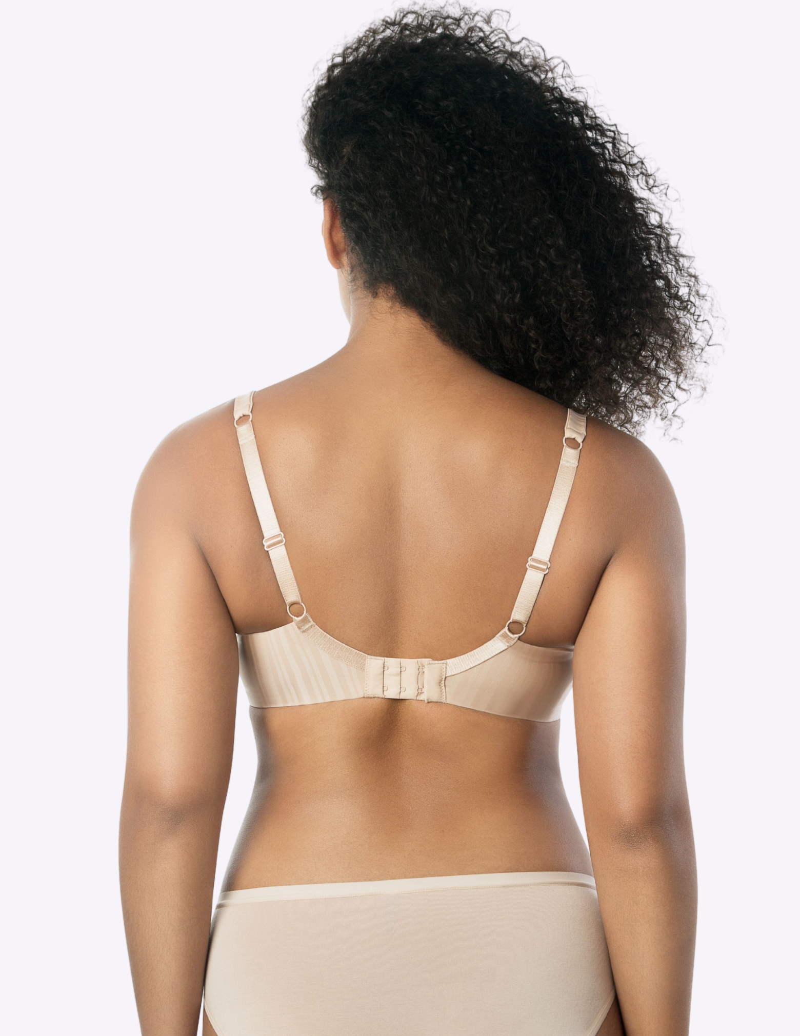 Back view of a model wearing beige Aline t-shirt bra