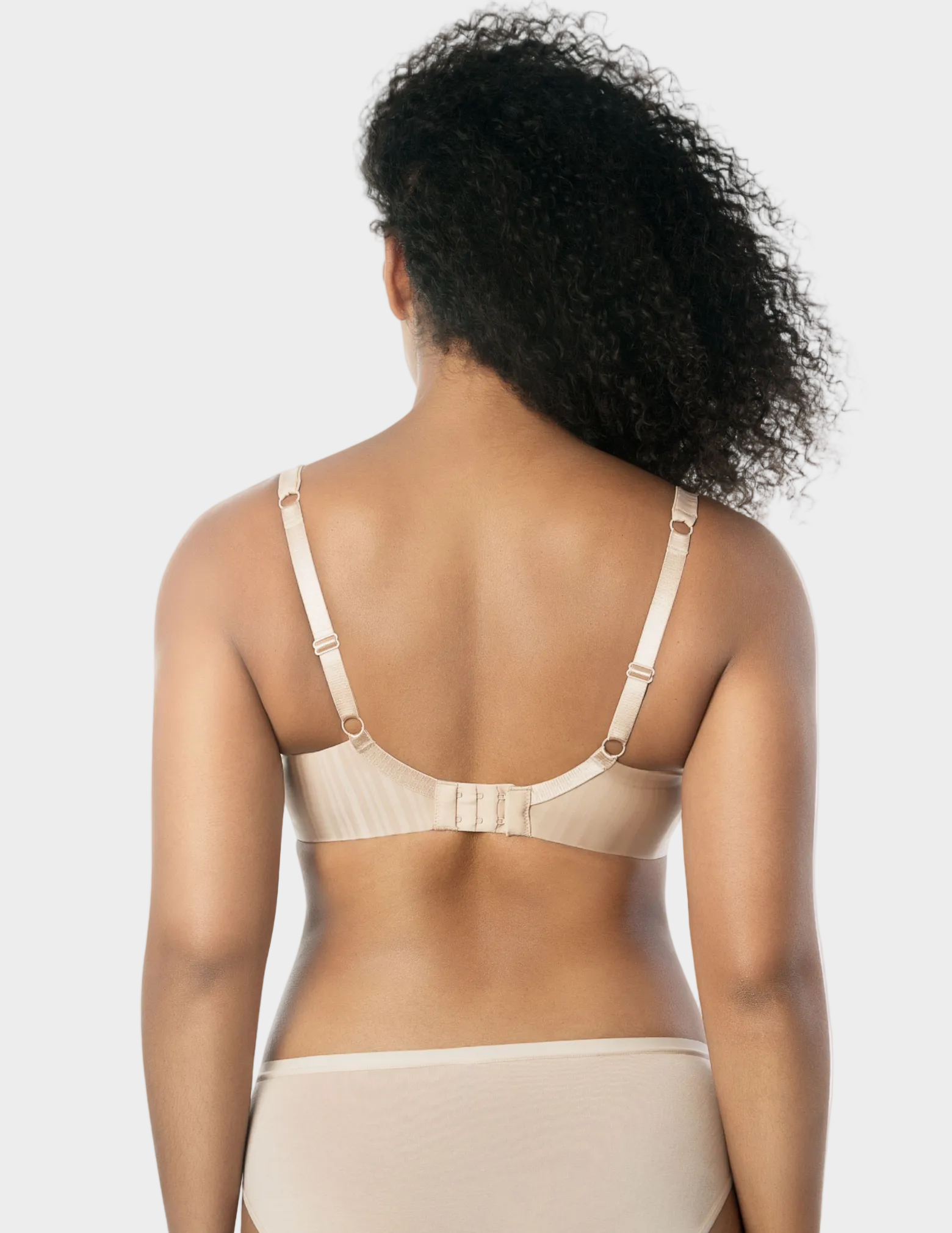 Back view of a model wearing beige Aline t-shirt bra
