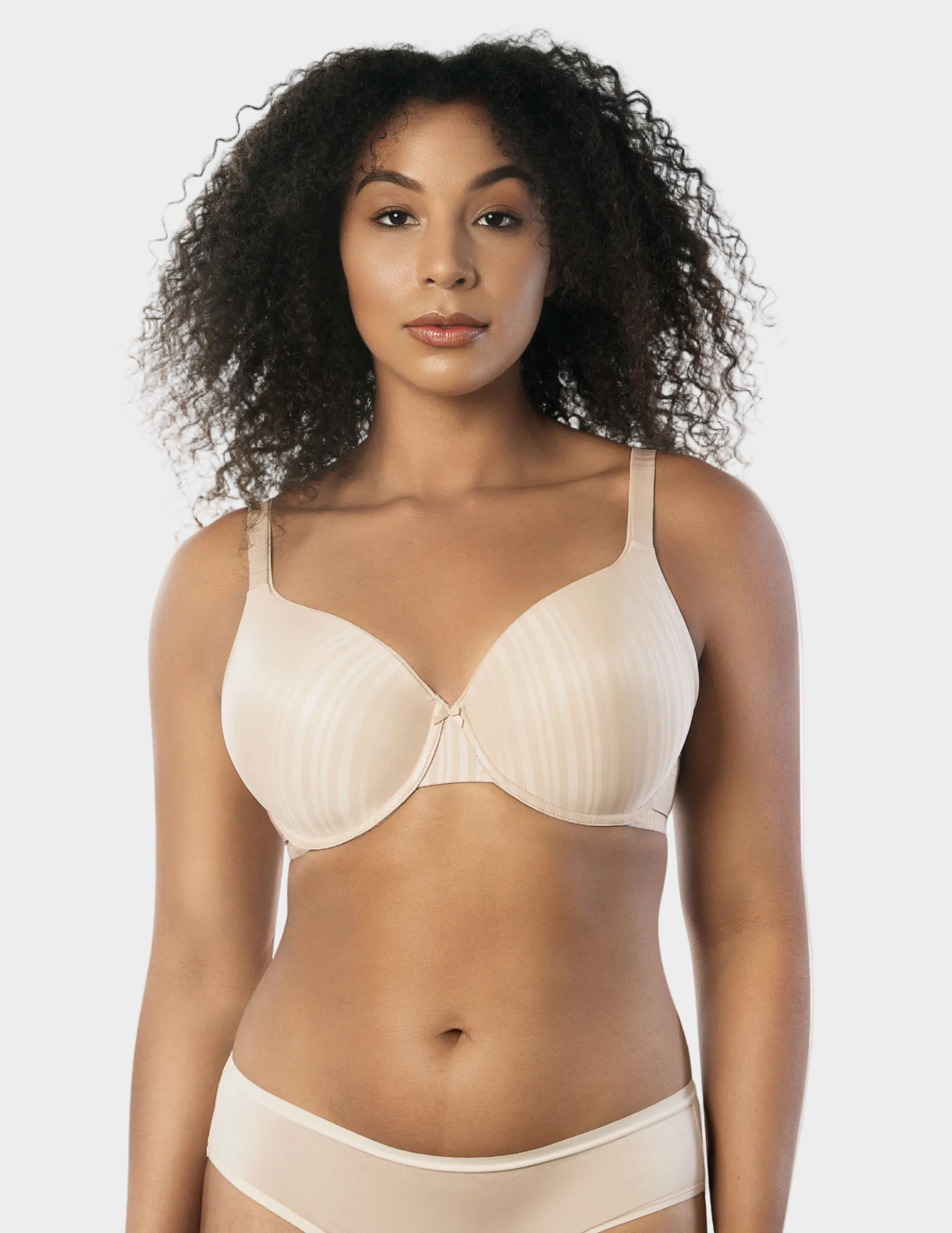 Front view of a model wearing beige Aline t-shirt bra