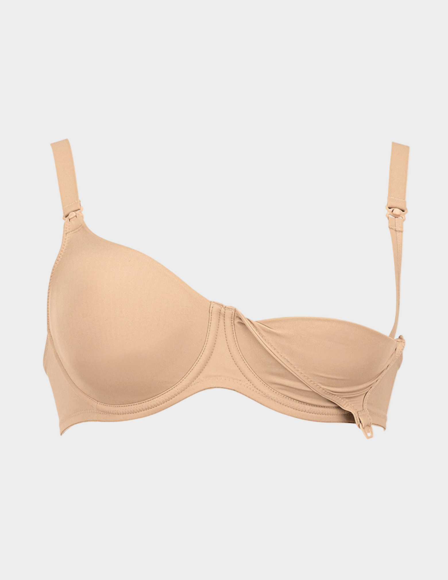 Beige nursing bra with one side unclipped on a light gray background