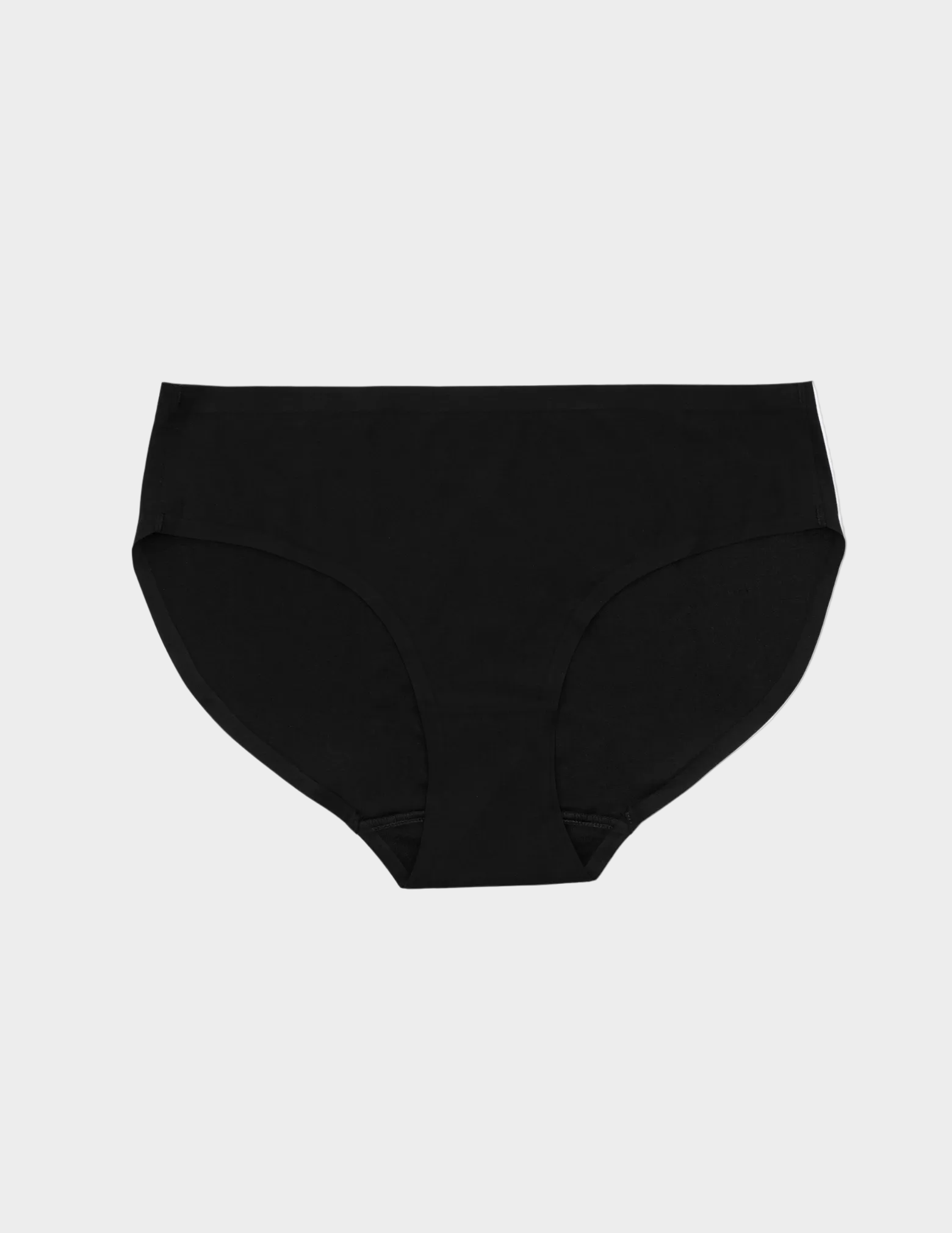 Flat lay of black seamless underwear on a white background