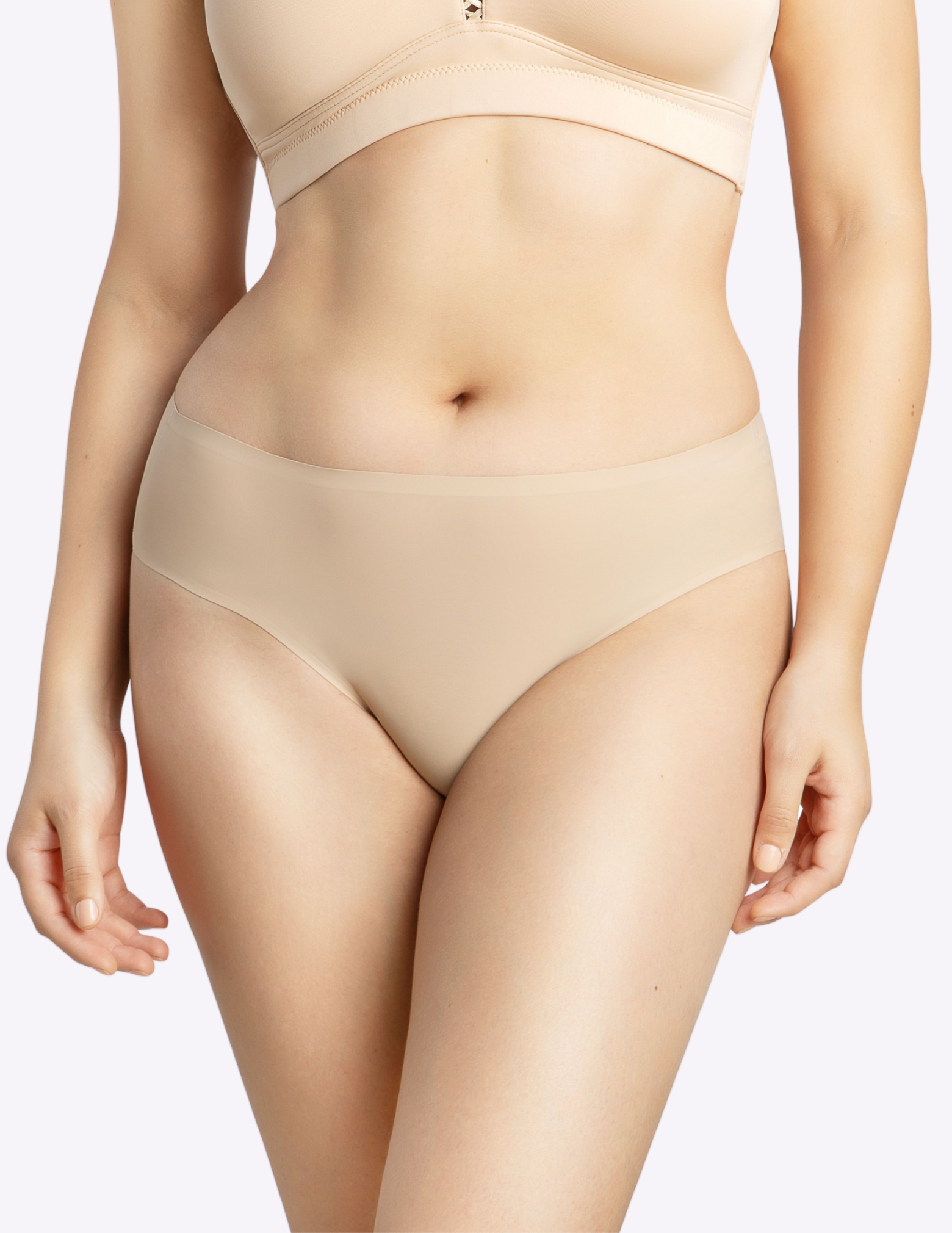 Front view of a model wearing bonded panty in european nude