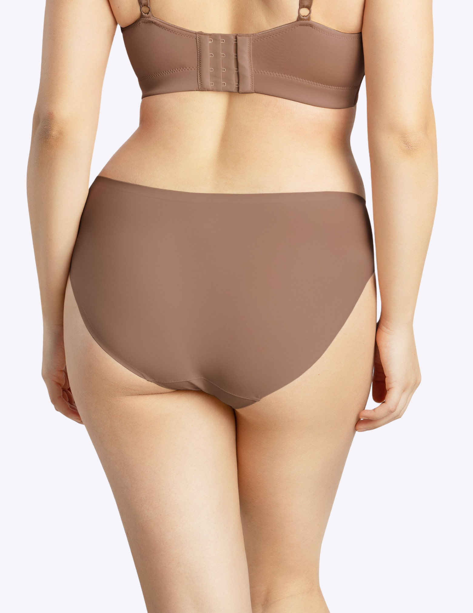 Back view of a model wearing bonded panty in mid nude