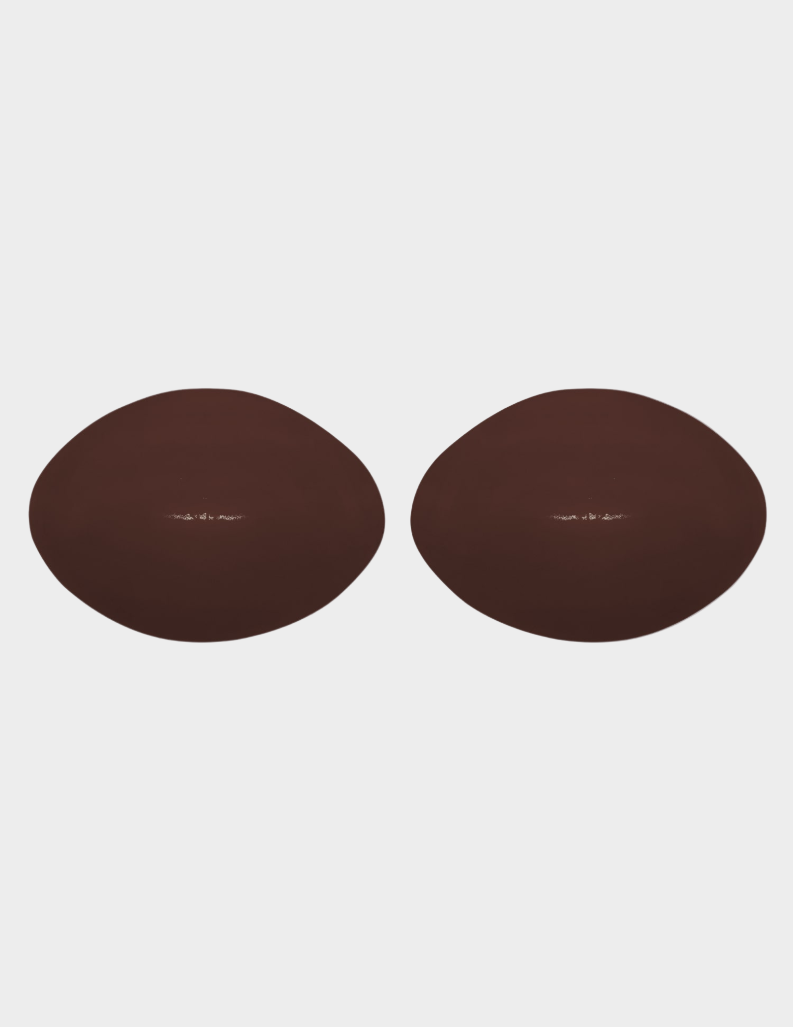 two brown bra inserts on white background
