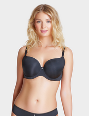 Woman wearing a black bra on a white background