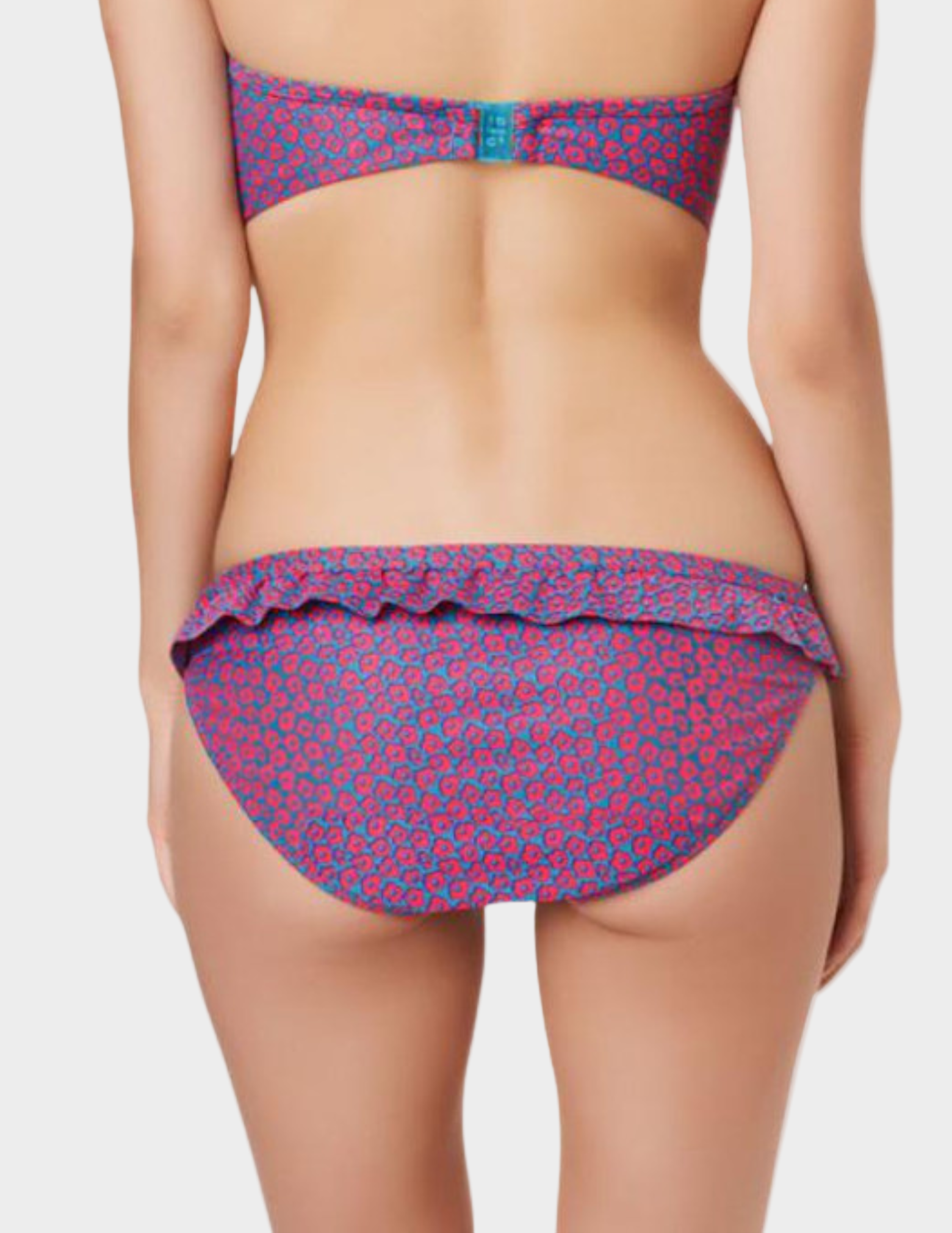 back view of woman wearing pink and blue floral ruffled swim bottom