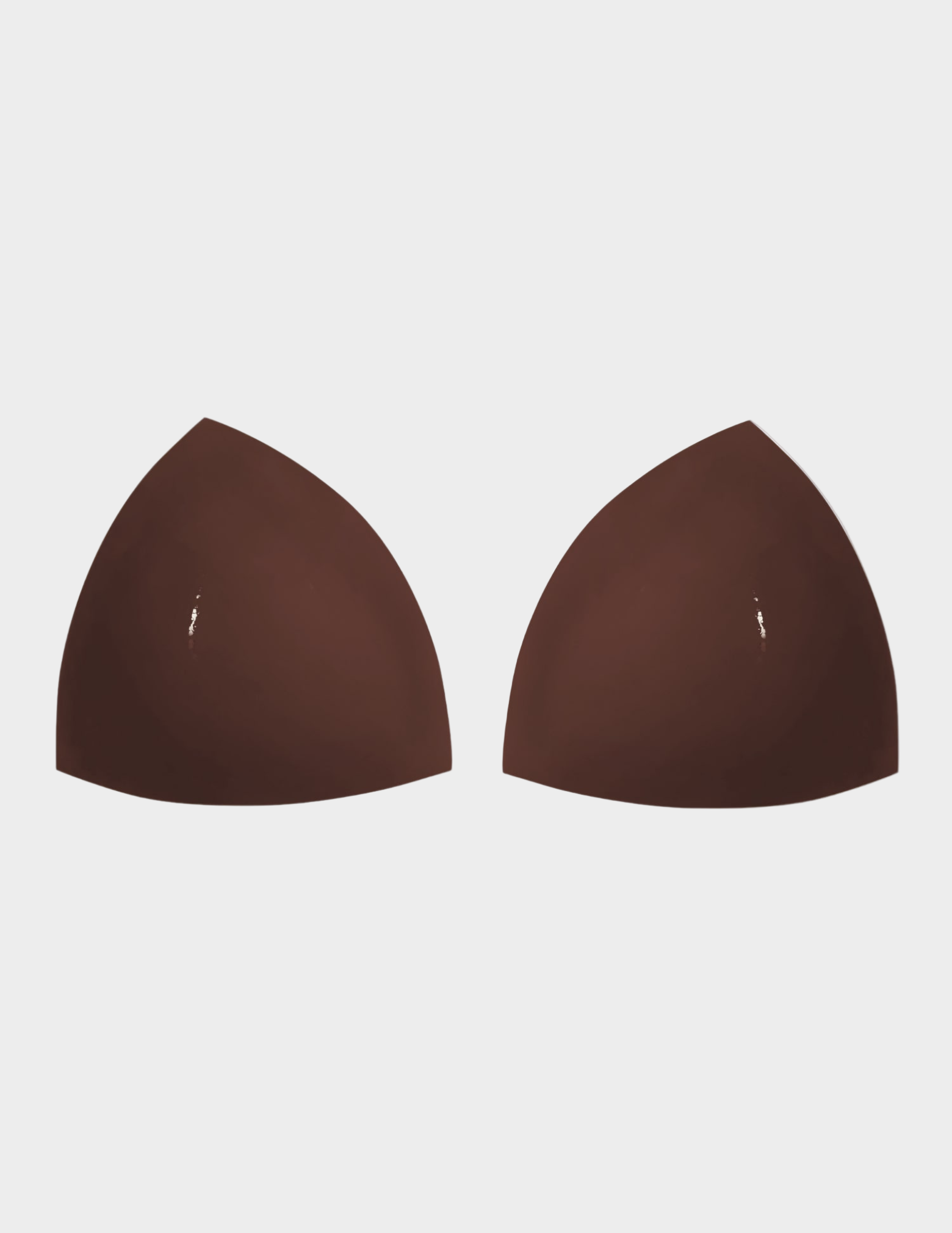 two brown triangle shaped bra inserts on white background